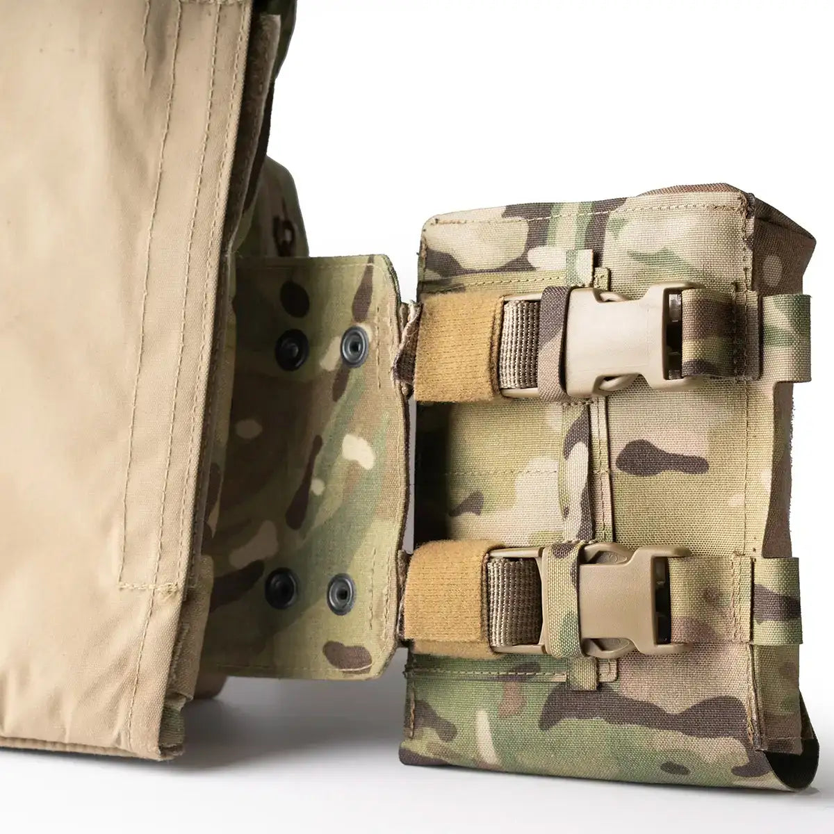 Close-up of Multicam tactical medical pouch attached to belt with secure buckles, designed for military or outdoor medical supplies
