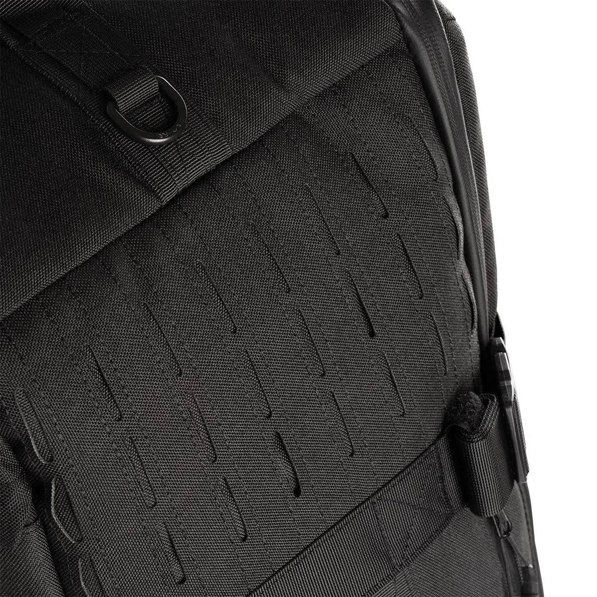 Close-up of Stoirm 50L Black Duffel Bag’s durable fabric with laser-cut MOLLE webbing and reinforced stitching for durability.