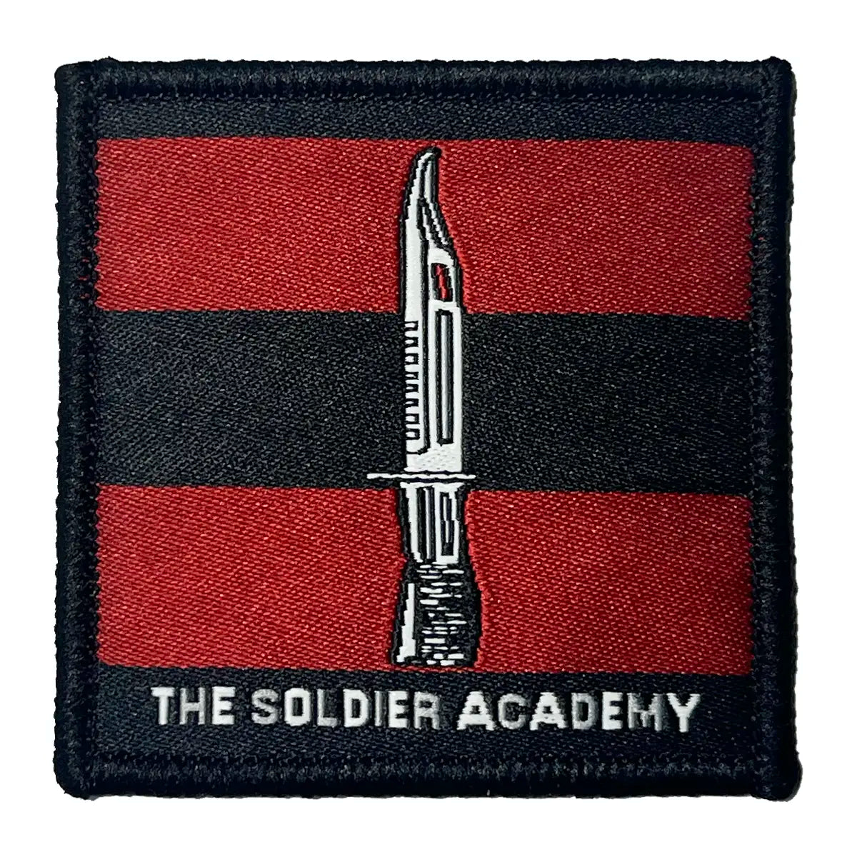 Single The Soldier Academy TRF patch with bayonet emblem on red and black stripes, regulation design for training team military uniforms.