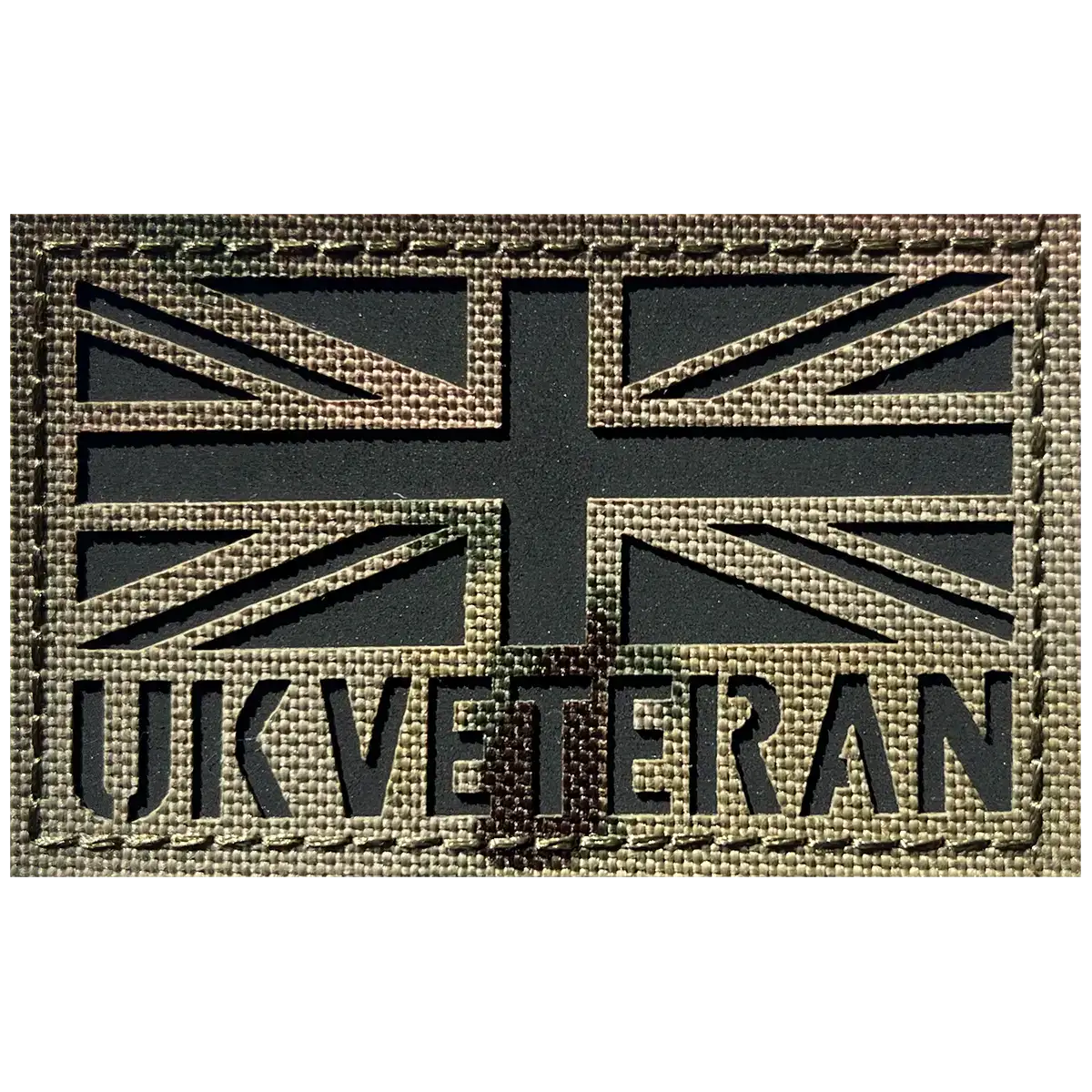 Close-up of UK Veteran Laser Cut Hook & Loop TRF Multicam patch showing detailed Velcro backing and textured fabric for secure attachment