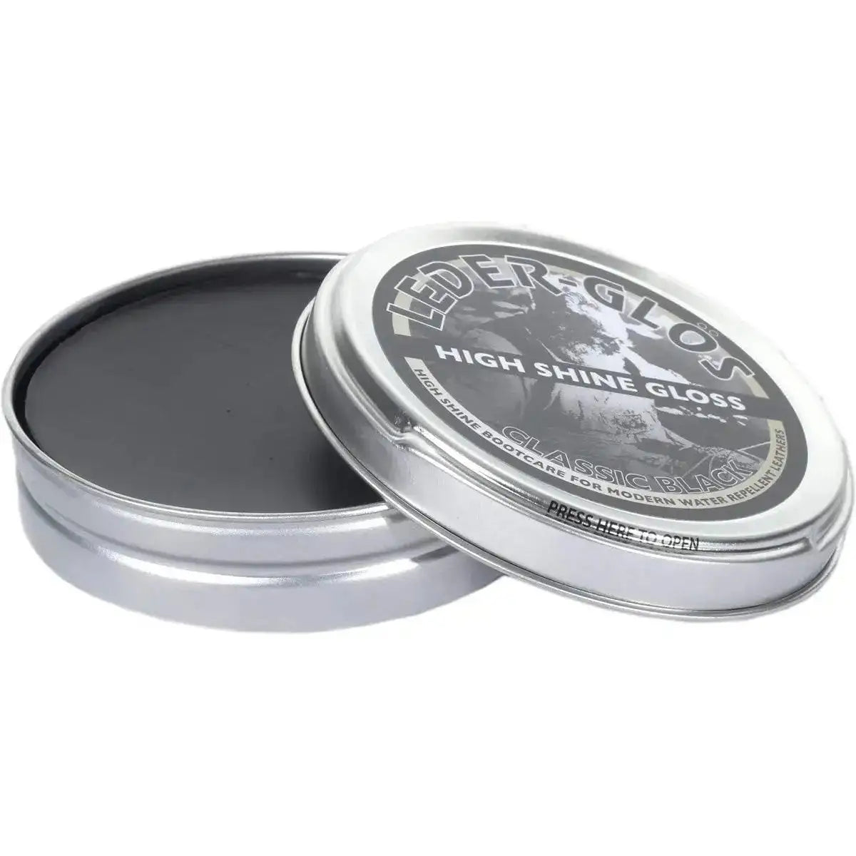 Open tin of Altberg Leder-Glos Classic Black high shine shoe polish, showing smooth black wax for polishing water repellent leather boots. from John Bull Clothing
