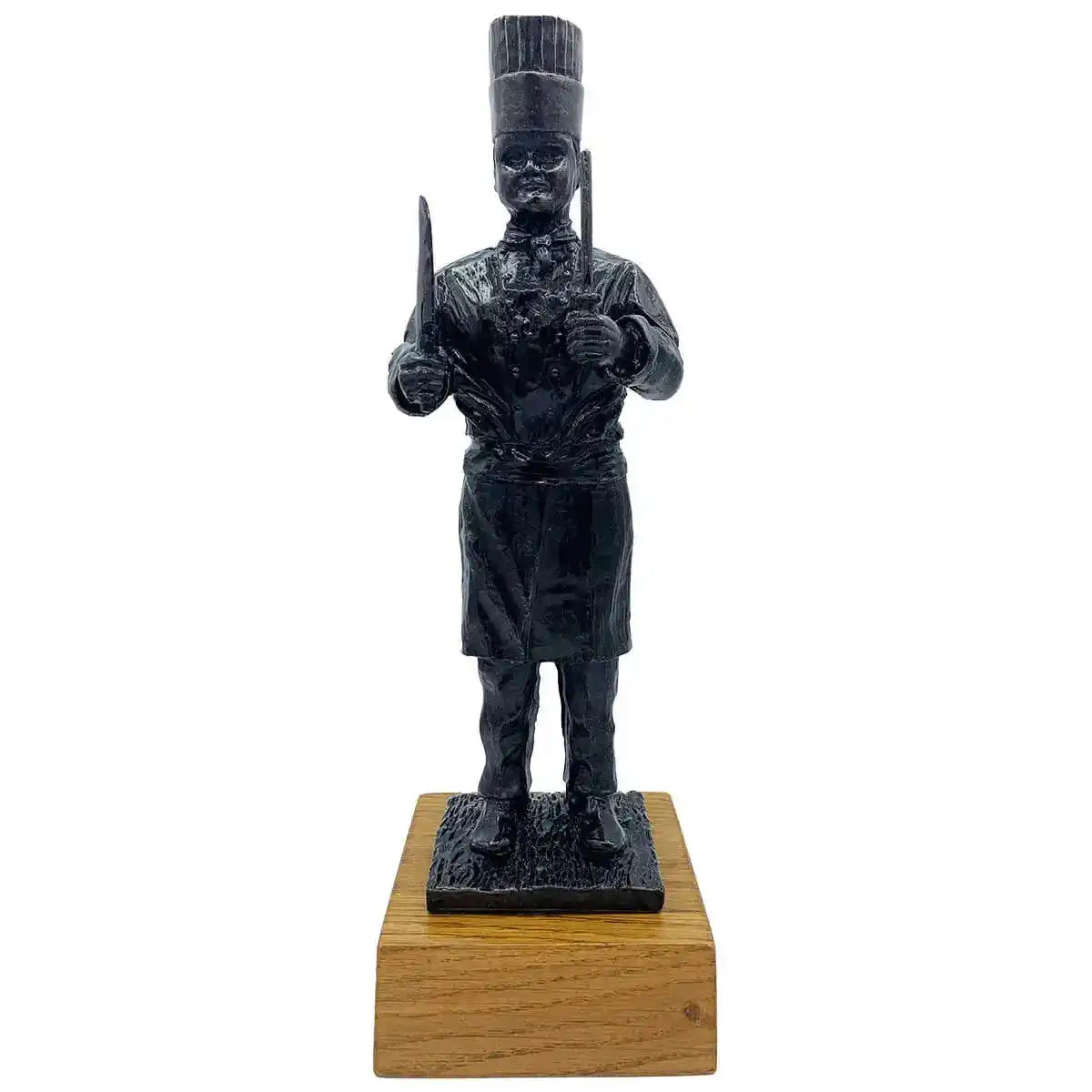 Army Chef Statue Bronze Resin | John Bull Clothing sculpture of a military chef holding utensils, mounted on a wooden base for home decor. from John Bull Clothing