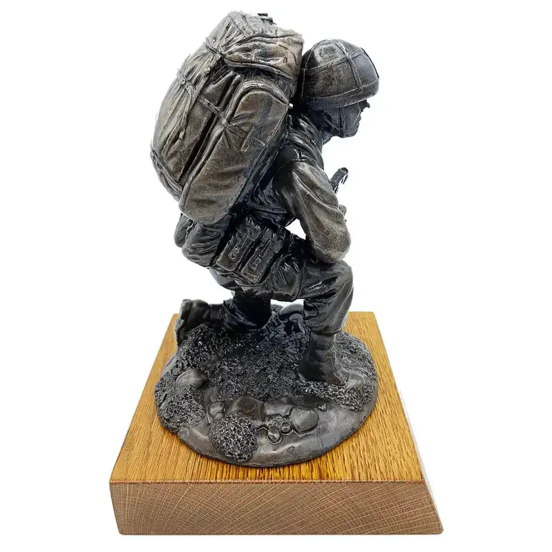 Left profile of Bronze Resin Kneeling Combat Statue with Helmet, showcasing tactical uniform and gear on oak base for military-themed decor. from John Bull Clothing