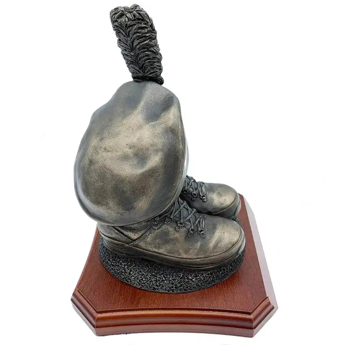 Angled side view of Caubeen and Boots Bronze Resin Statue, capturing realistic boot details and caubeen shape on wood base. from John Bull Clothing