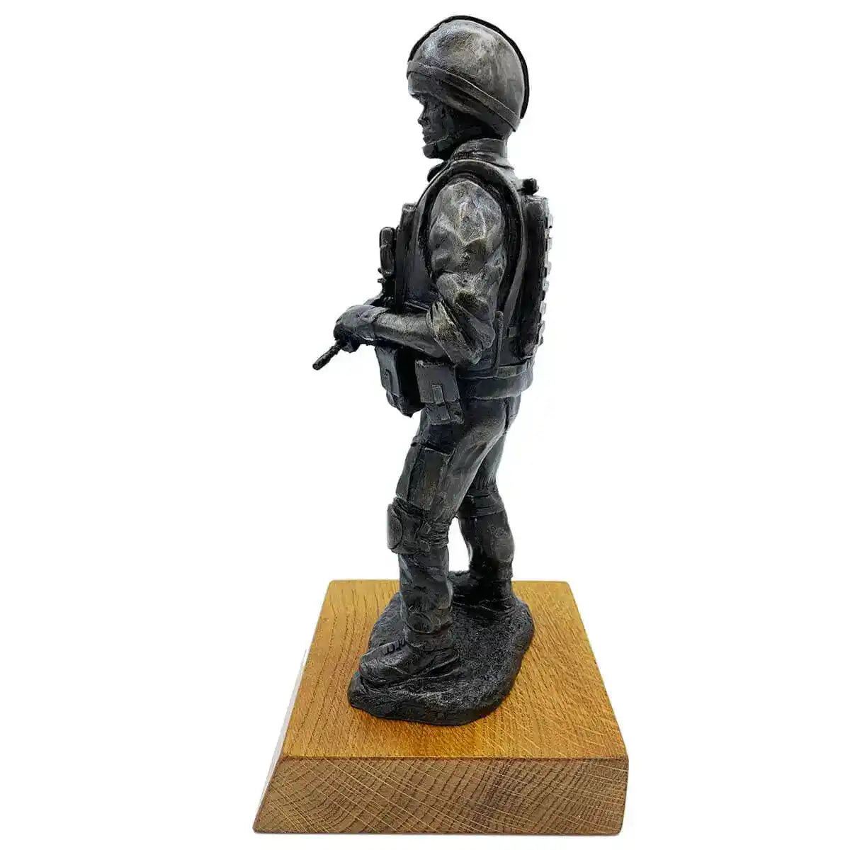 Side profile of British Standing Combat Patrol Bronze Statue showing detailed resin sculpting of uniform, gear, and helmet on oak base. from John Bull Clothing