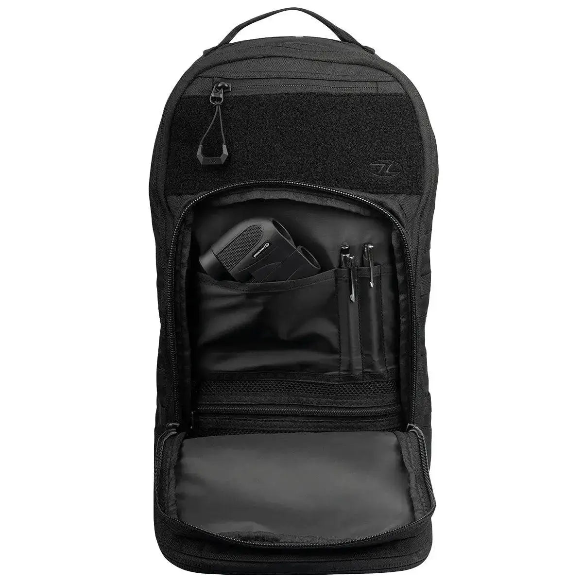 Front compartment of Highlander Harrier 25L Clamshell Rucksack in black, displaying organized storage for essentials like gadgets and stationery. from John Bull Clothing