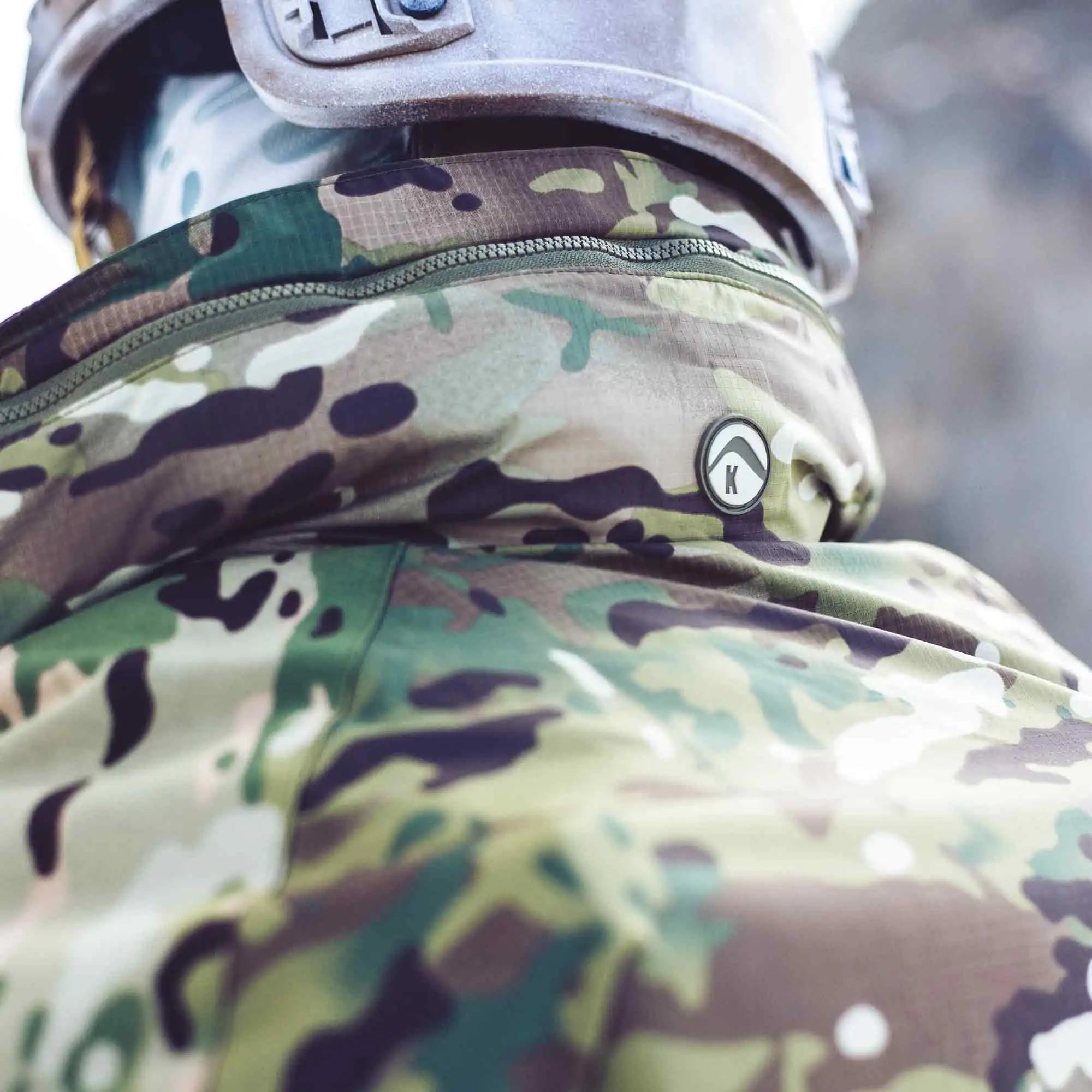 Close-up of the Keela Mk5 Waterproof Jacket MTC collar, highlighting the waterproof fabric and Keela logo for premium outdoor performance. from John Bull Clothing