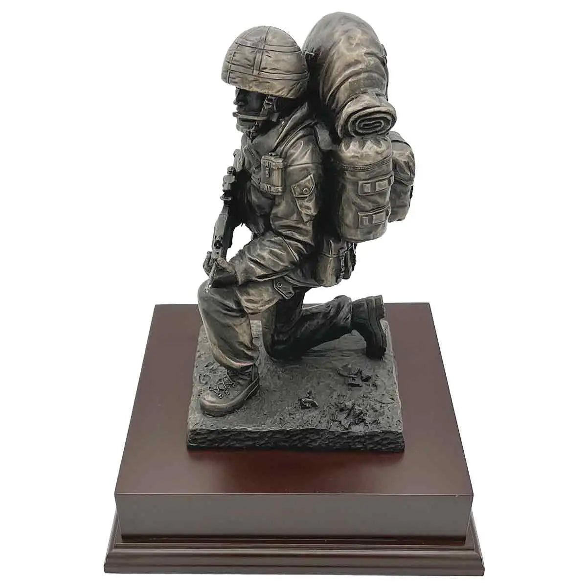 Kneeling Combat Figure with Beret statue in bronze finish, showing soldier in action-ready pose with full combat equipment on wooden base. from John Bull Clothing