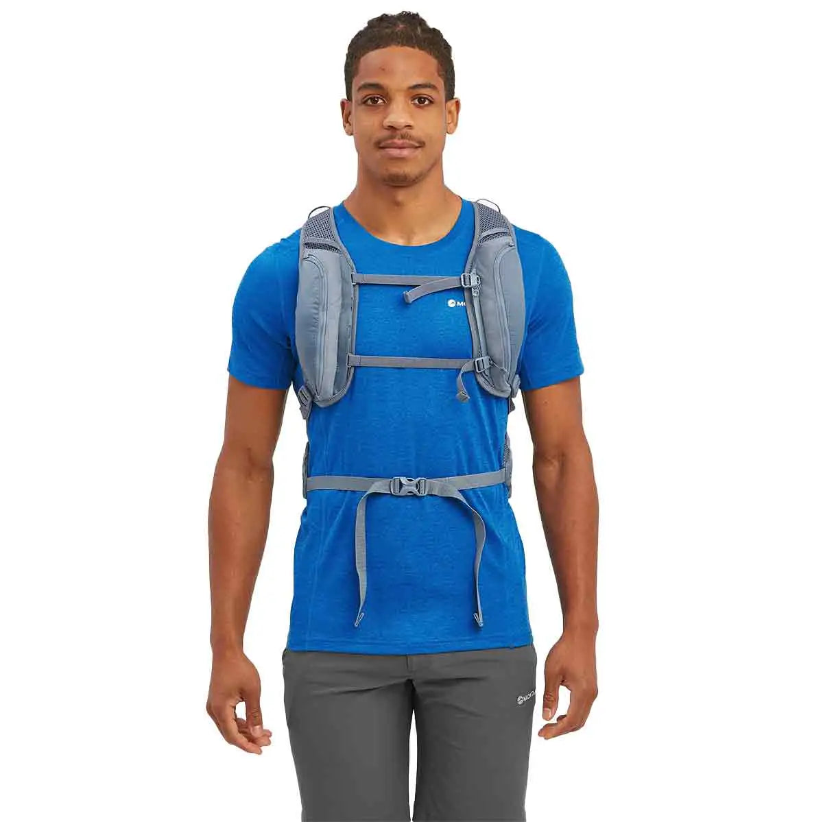Front view of a man wearing the Montane Trailblazer 18L Backpack, showing adjustable chest straps for a secure fit. from John Bull Clothing