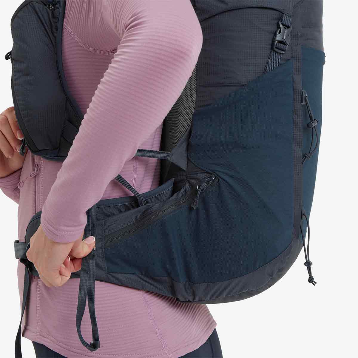 Side view of Montane Trailblazer 24L Womens Rucksack, showing zippered hip belt pockets and ergonomic design for balanced weight distribution.