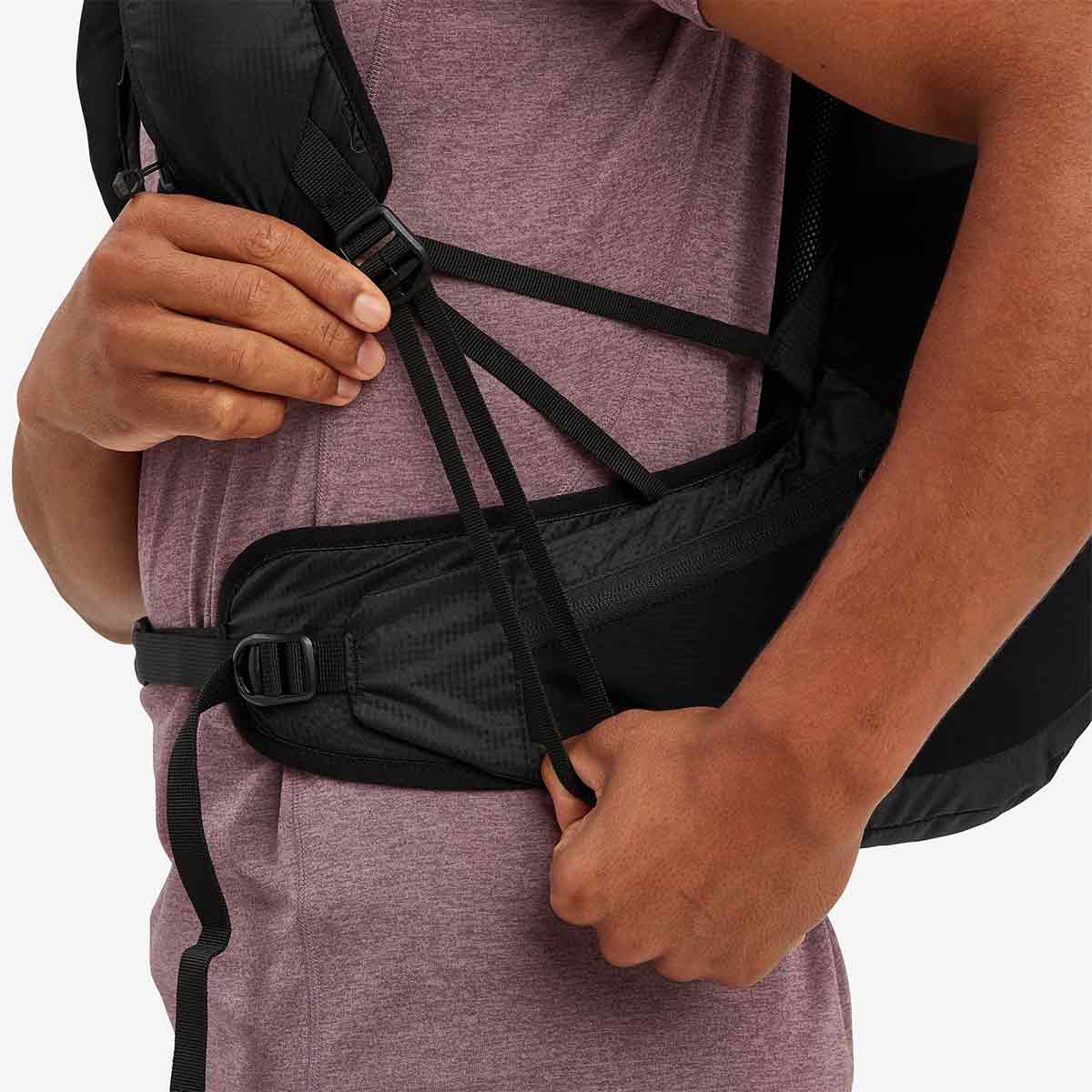 Close-up of the Montane Trailblazer 25L Rucksack’s adjustable waist strap, ensuring a secure and comfortable fit for outdoor activities.