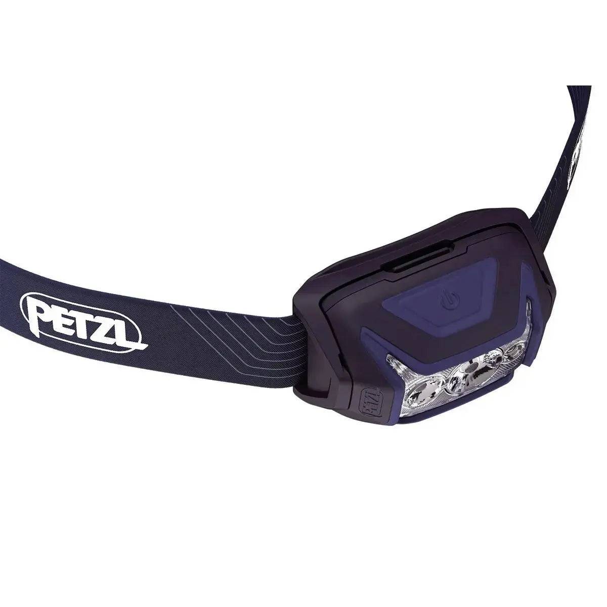 Close-up of the Petzl Actik Headtorch with Red Lighting 450 Lumens in dark blue, highlighting its ergonomic design and powerful LED lights.