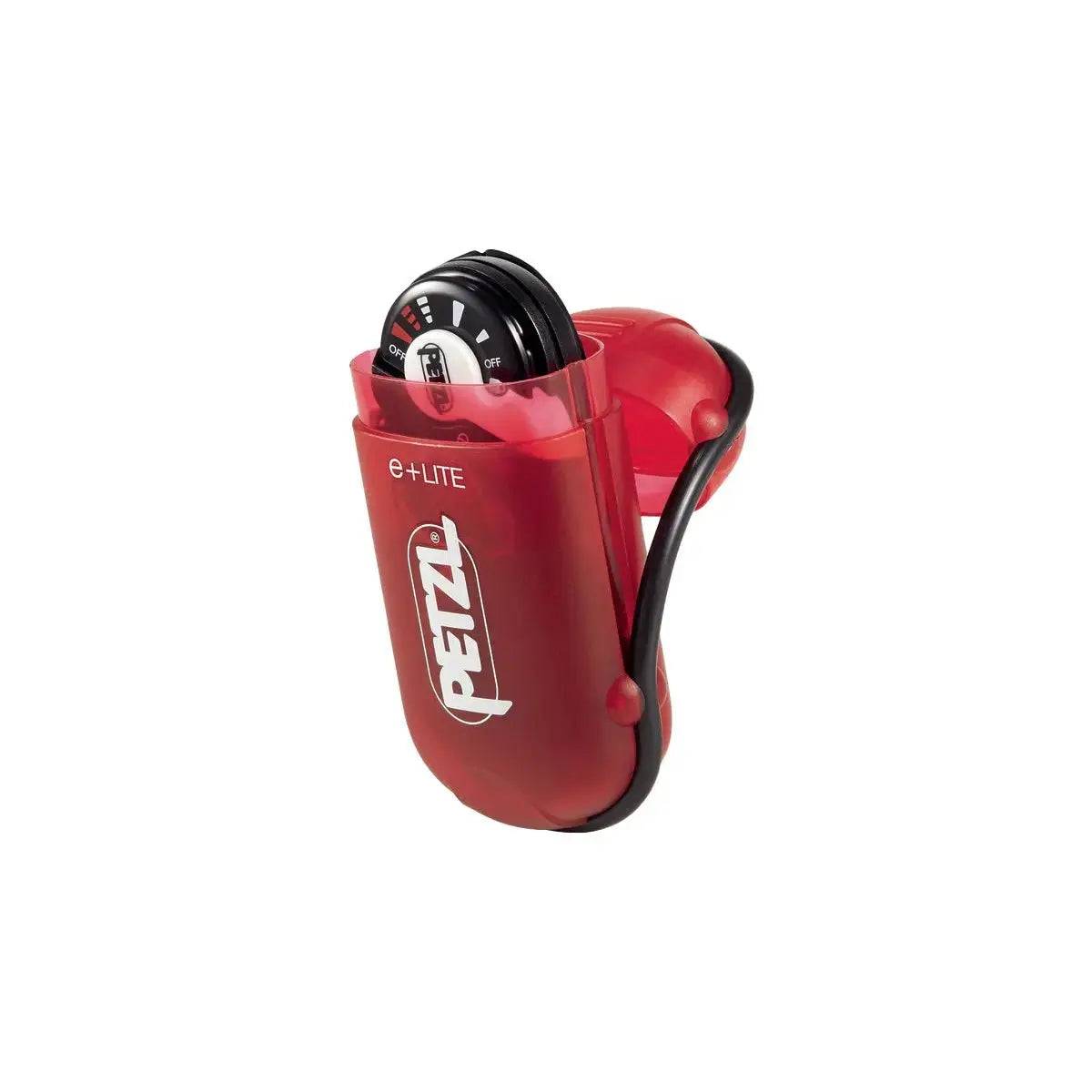 Petzl E+Lite Compact Emergency Head Torch stored in its red protective case, designed for portability and durability in outdoor and emergency situations.