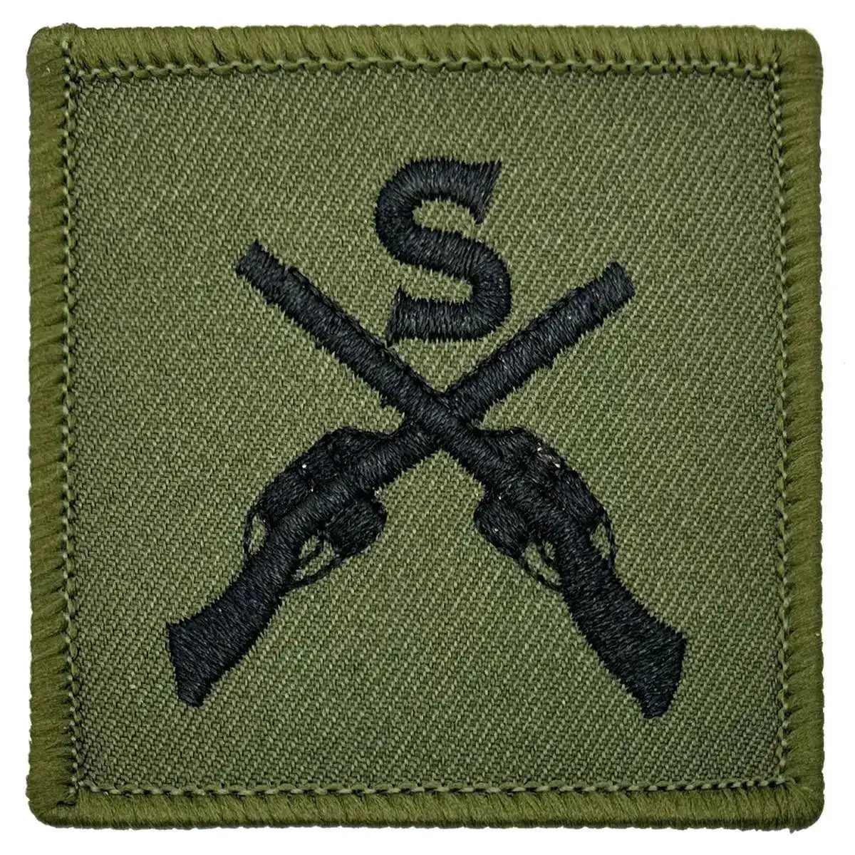 Close-up of Sniper Trade TRF - Iron On Patch | John Bull Clothing showing detailed embroidery of black crossed rifles and 'S' on green cotton fabric. 1 Flash from John Bull Clothing