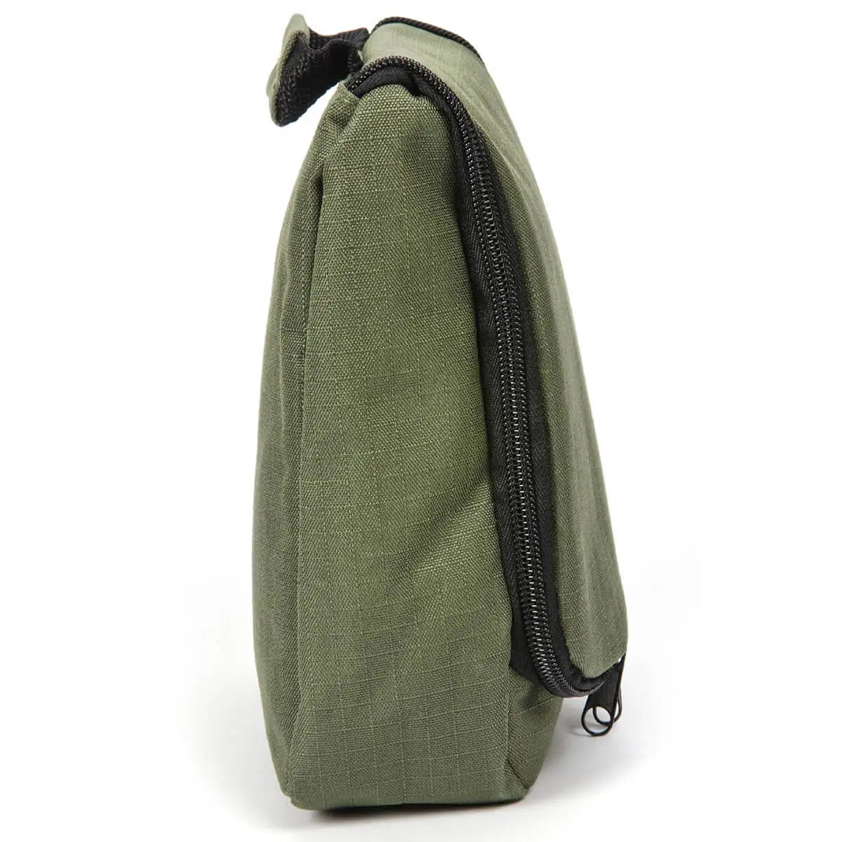 Side view of the Snugpak Essential Travel Wash Bag, showcasing its sturdy polyester material and zippered compartments for secure storage. from John Bull Clothing