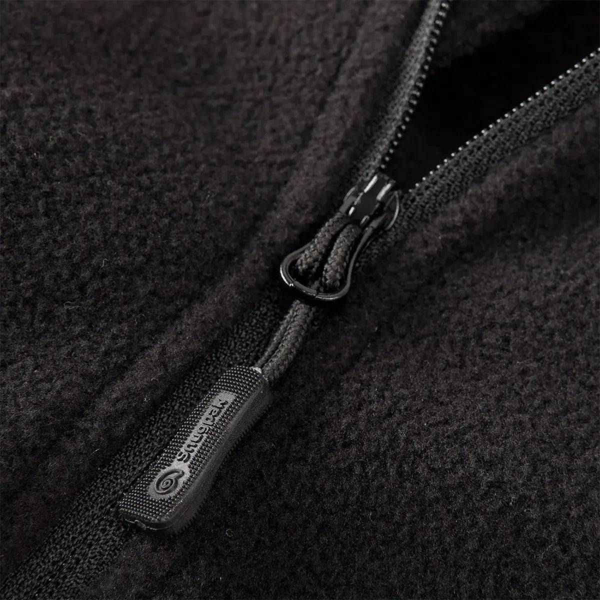 Close-up of Snugpak Impact Black Fleece Shirt zipper, highlighting durable construction and soft fleece material for enhanced comfort and insulation.
