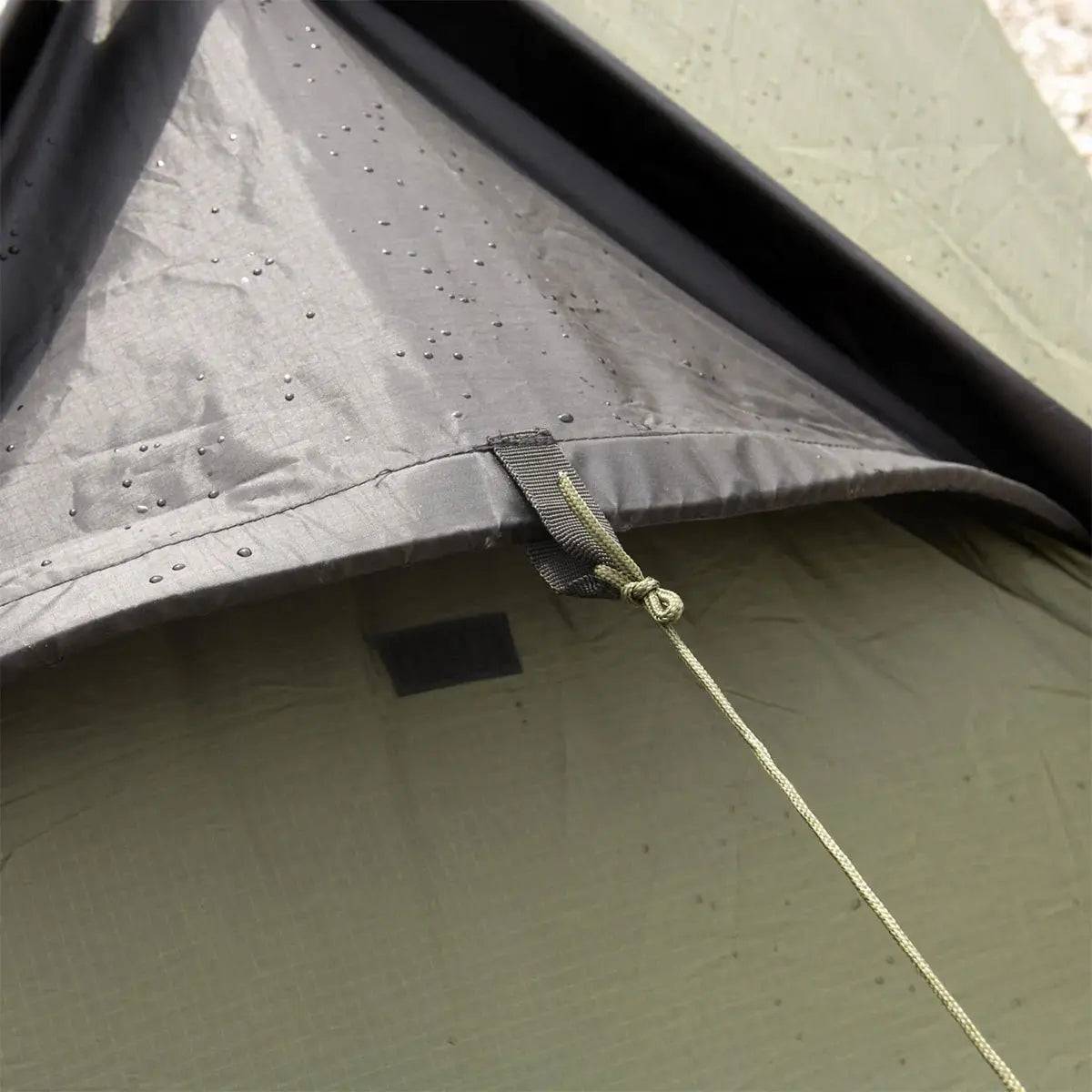 Water-resistant fabric and reinforced seams of the Snugpak Scorpion 3 IX Hiking Tent, designed for durability in wet conditions.
