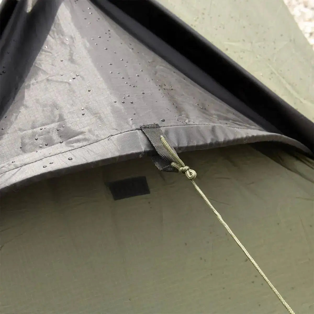 Water-resistant fabric and reinforced seams of the Snugpak Scorpion 3 IX Hiking Tent, designed for durability in wet conditions. from John Bull Clothing