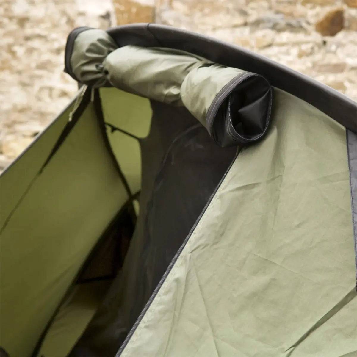 Close-up of the Snugpak Scorpion 3 IX Hiking Tent's entrance, highlighting the roll-up door and mesh ventilation for airflow control.