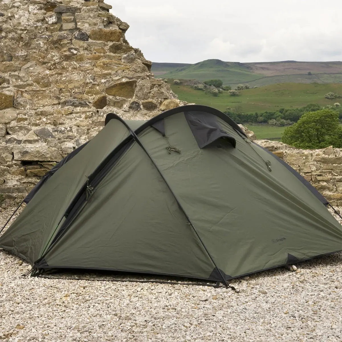 Side view of the Snugpak The Bunker IX Expedition Tent in Olive, showcasing its sturdy, weather-resistant structure for camping and hiking.