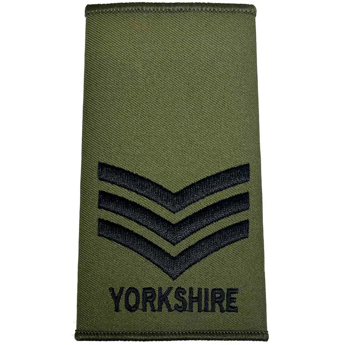 Yorkshire Regiment Olive Green Rank Slide with three black chevrons and 'YORKSHIRE' text, indicating a sergeant rank. Sergeant from John Bull Clothing