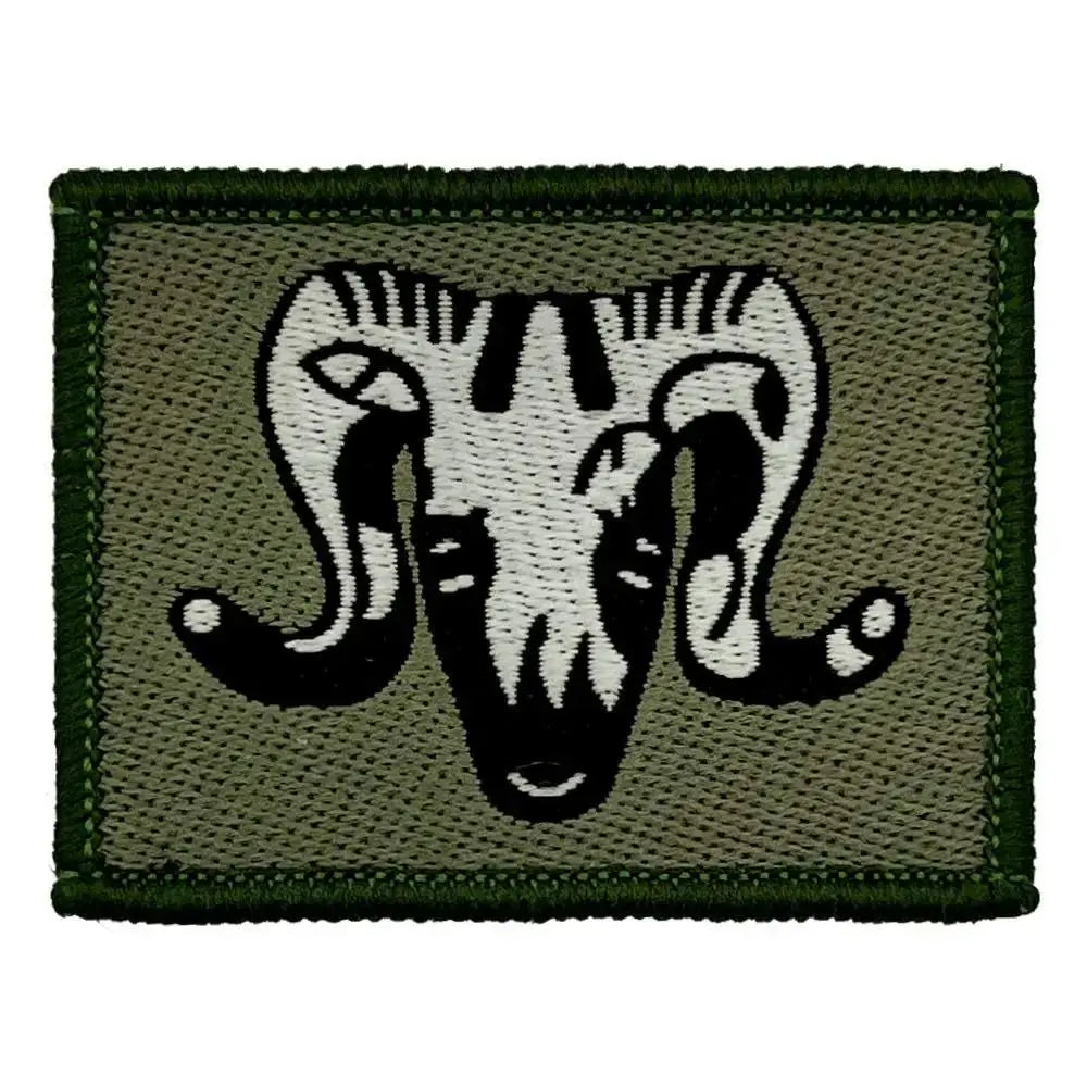 Single 1st Artillery Brigade TRF Hook & Loop Backing patch with black and white ram emblem on green fabric, ideal for tactical military wear.