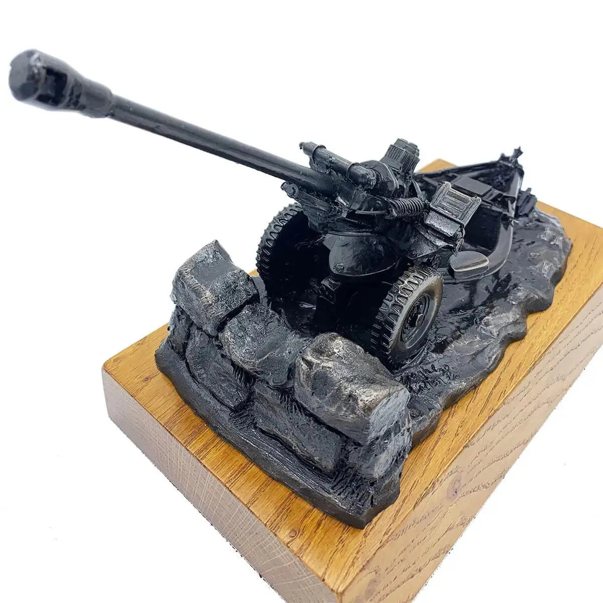 Angled top view of 105mm Light Gun Bronze Resin Statue highlighting craftsmanship and swivel gun barrel, from John Bull Clothing's decor range.