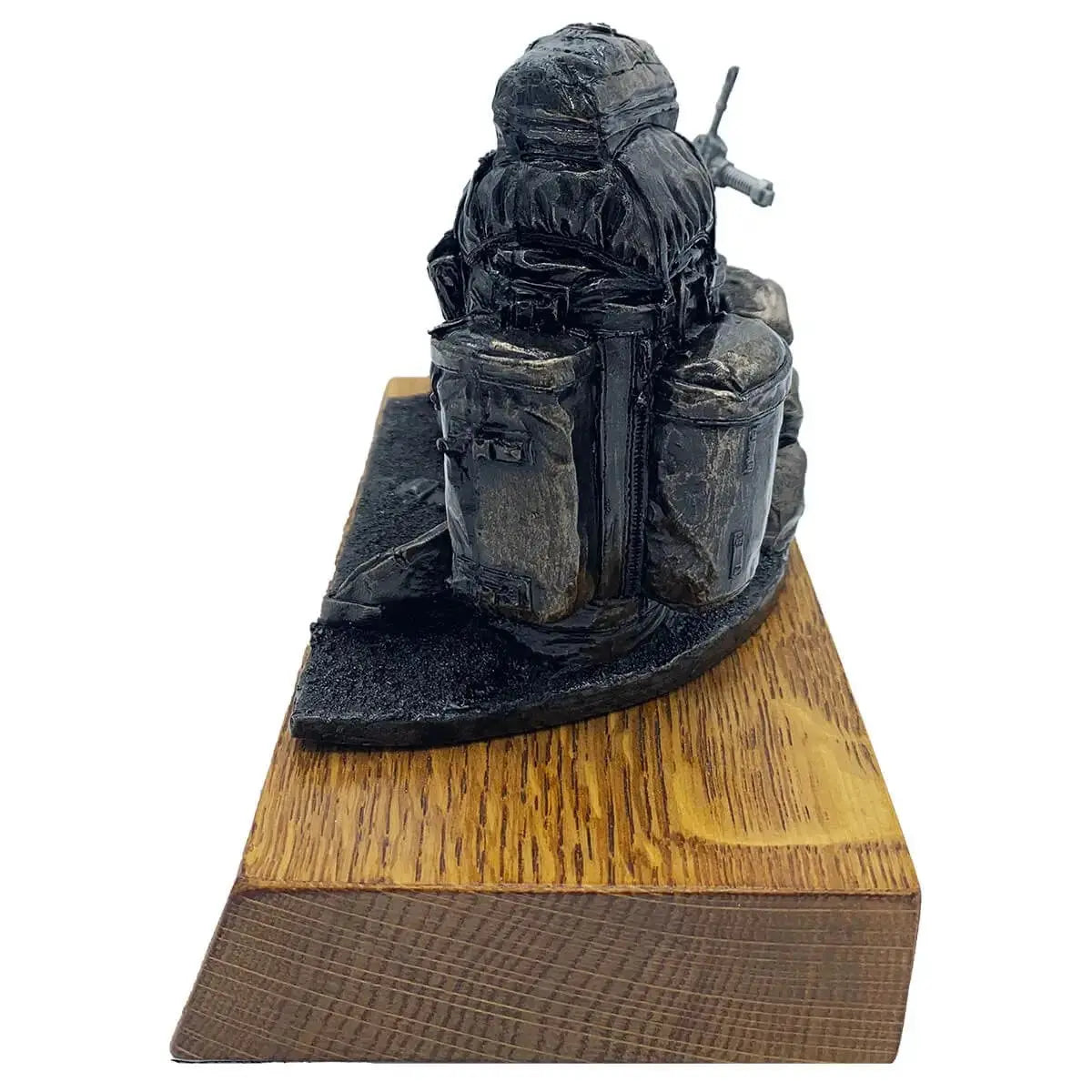 Side view of Bergen and SA80 bronze resin army statue showing intricate backpack details on solid oak base, ideal for military-themed decor.