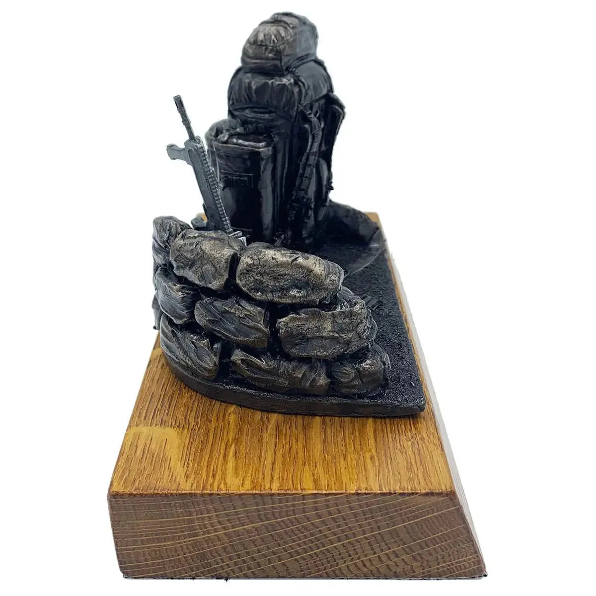 Side profile of Bergen and SA80 bronze resin statue with sandbag wall and rifle, crafted for army memorabilia and home decoration.