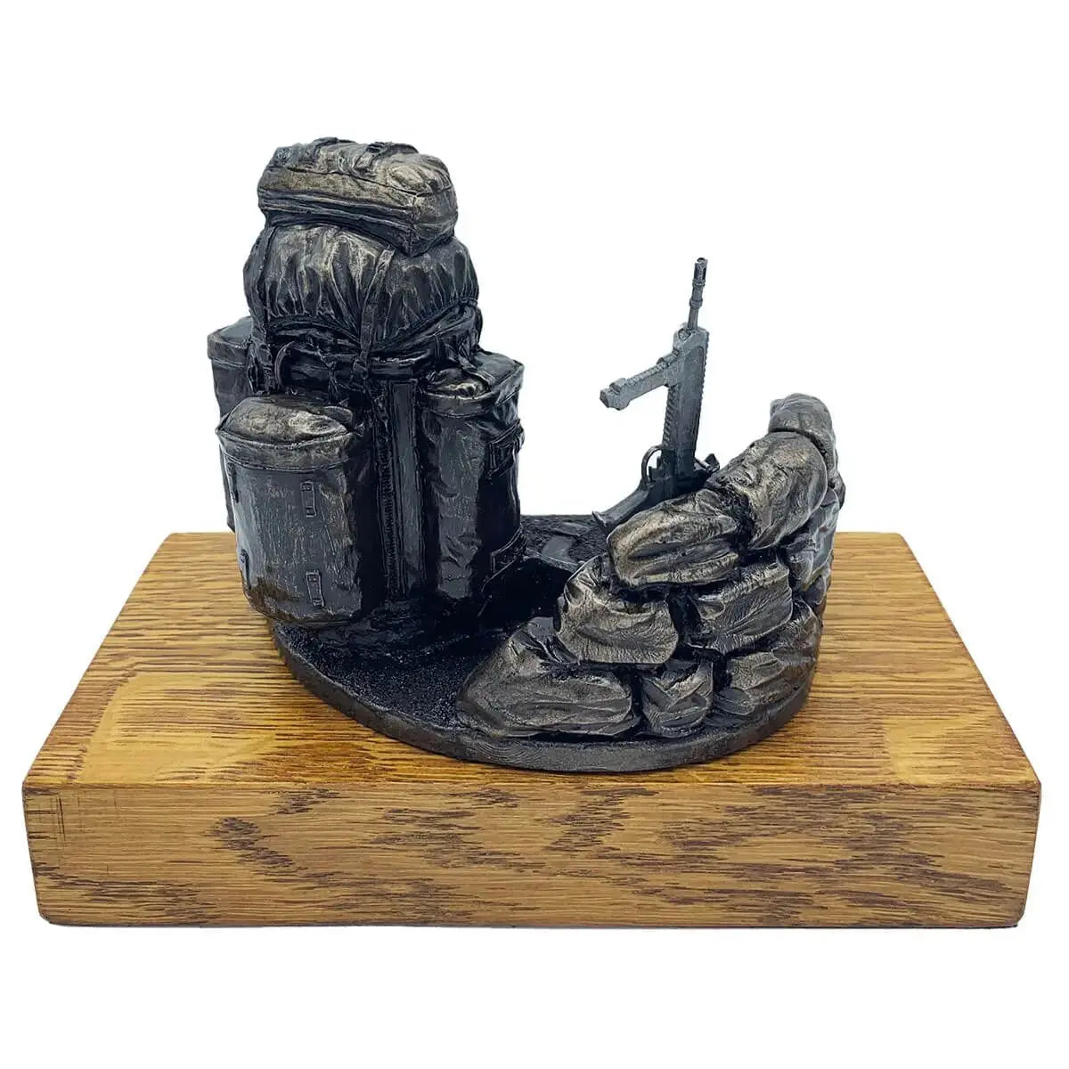 Rear angle of Bergen and SA80 bronze resin army presentation with sandbags and rifle, mounted on oak base for collectible or gift display.