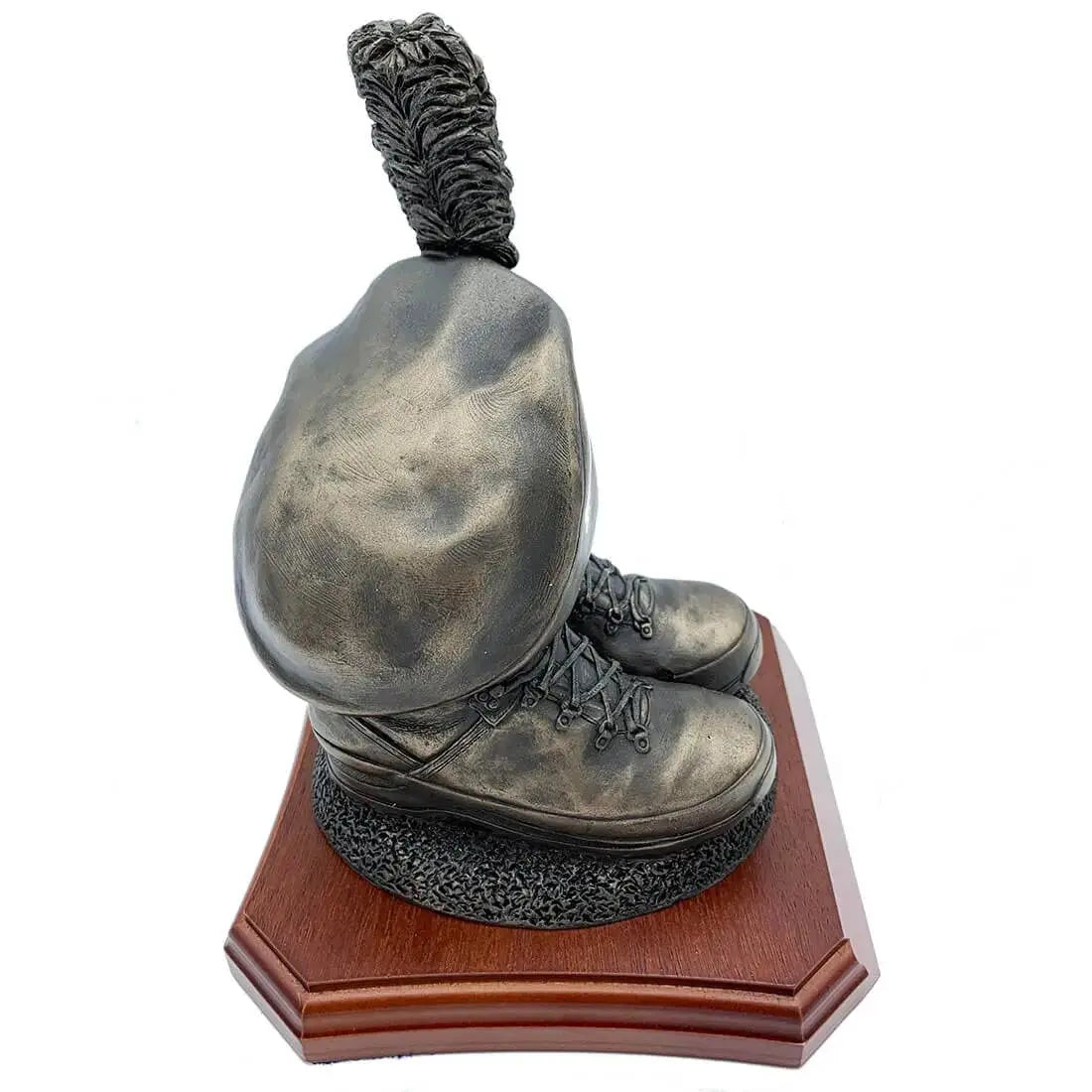 Angled side view of Caubeen and Boots Bronze Resin Statue, capturing realistic boot details and caubeen shape on wood base.