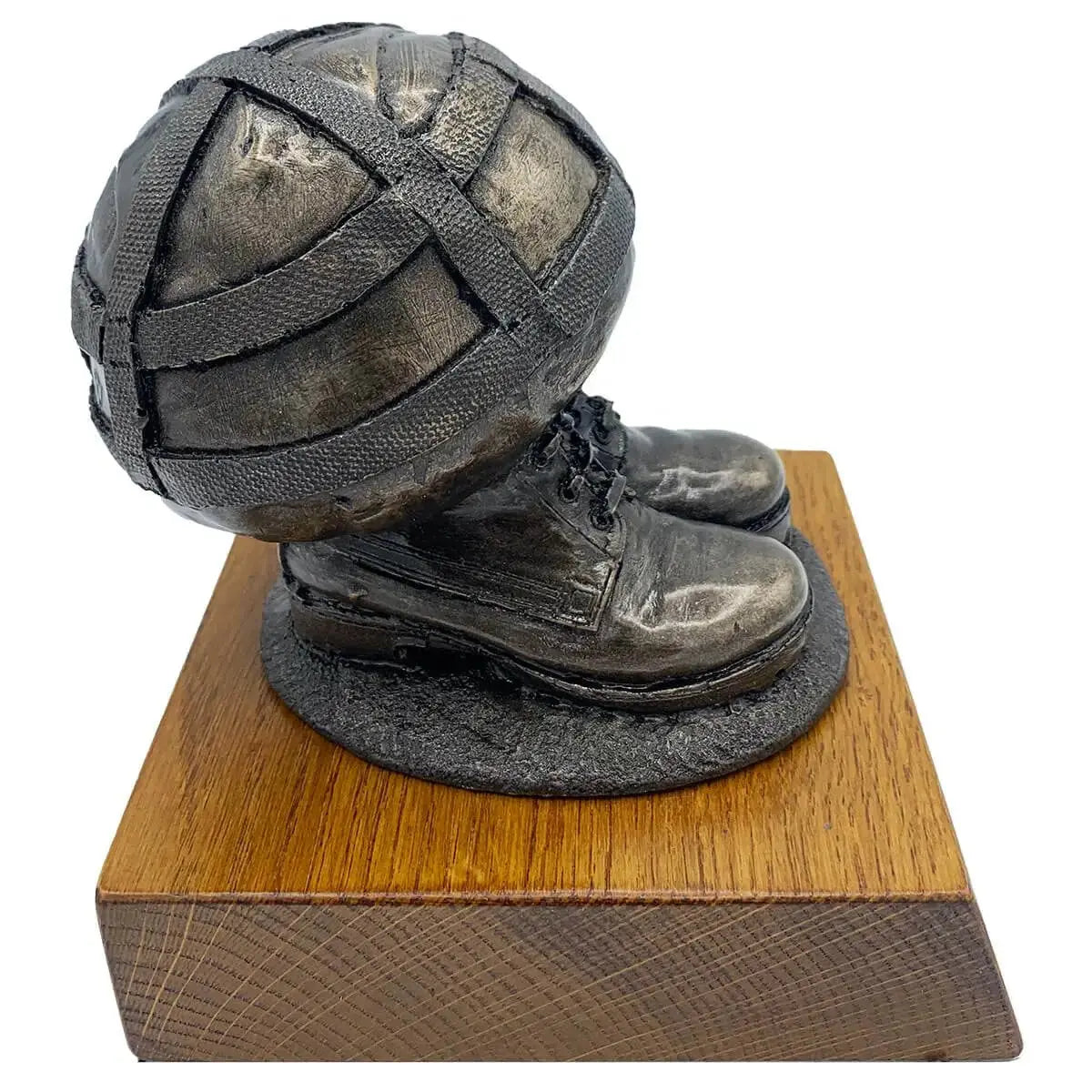 Angled view of Helmet & Boots Bronze Resin Statue highlighting realistic military gear design and sturdy wooden base.