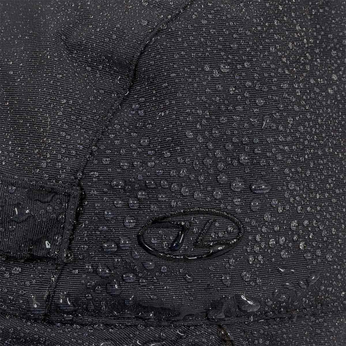 Close-up of water droplets on Highlander Dry Tech Mountain Waterproof Hat's Ab-Tex coated nylon fabric, showcasing waterproof performance.