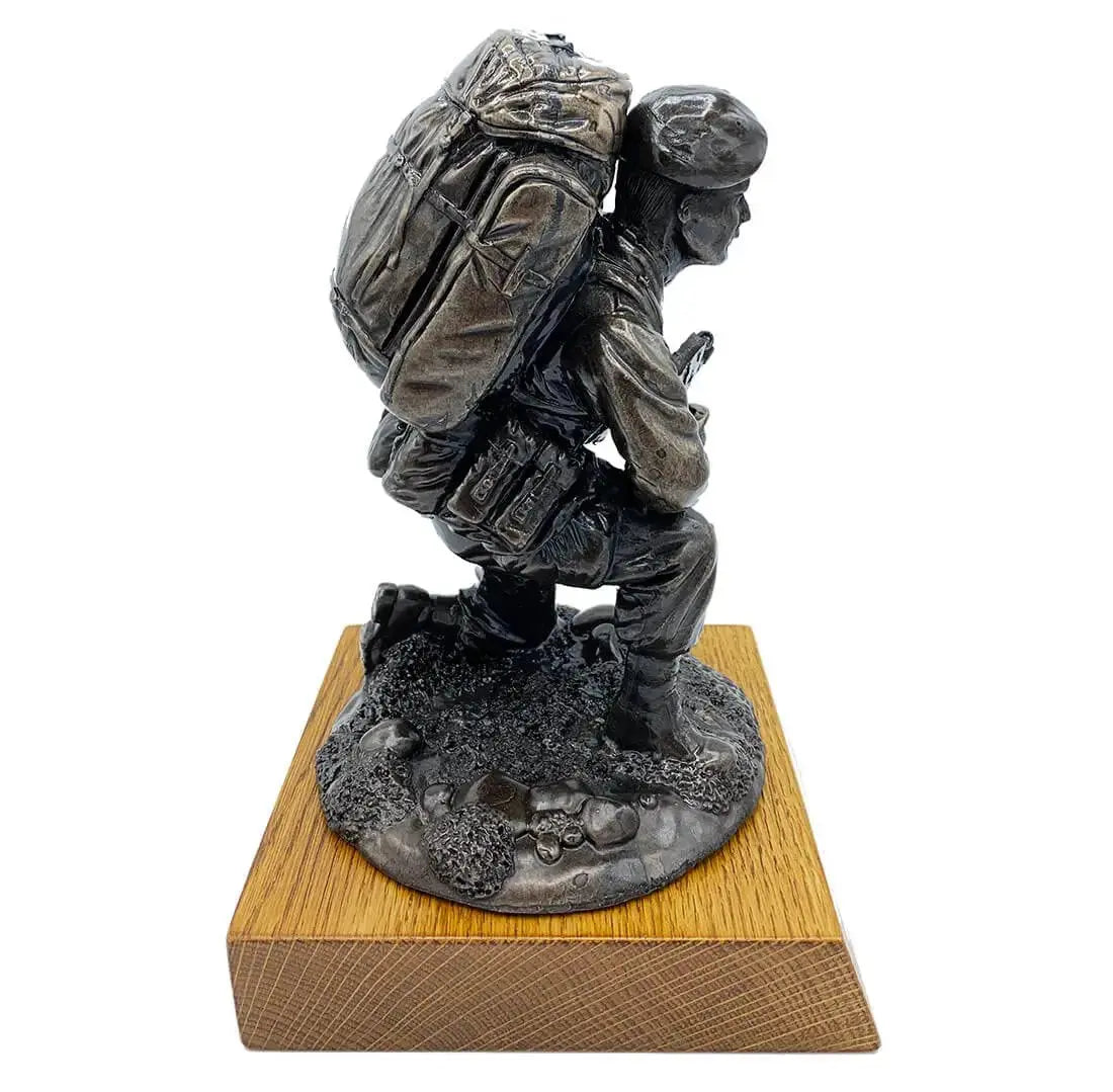 Right profile of Kneeling Combat Figure with Beret Bronze Statue on oak base, showcasing realistic military gear and combat readiness.
