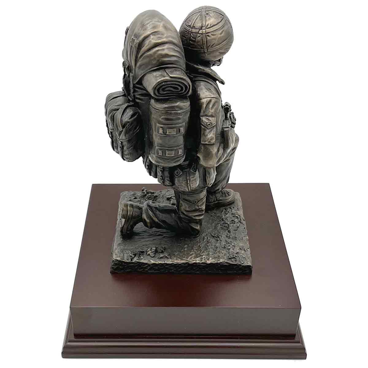 Side view of Kneeling Combat Figure with Beret statue showing soldier's backpack and kneeling pose, a tribute piece for army enthusiasts.