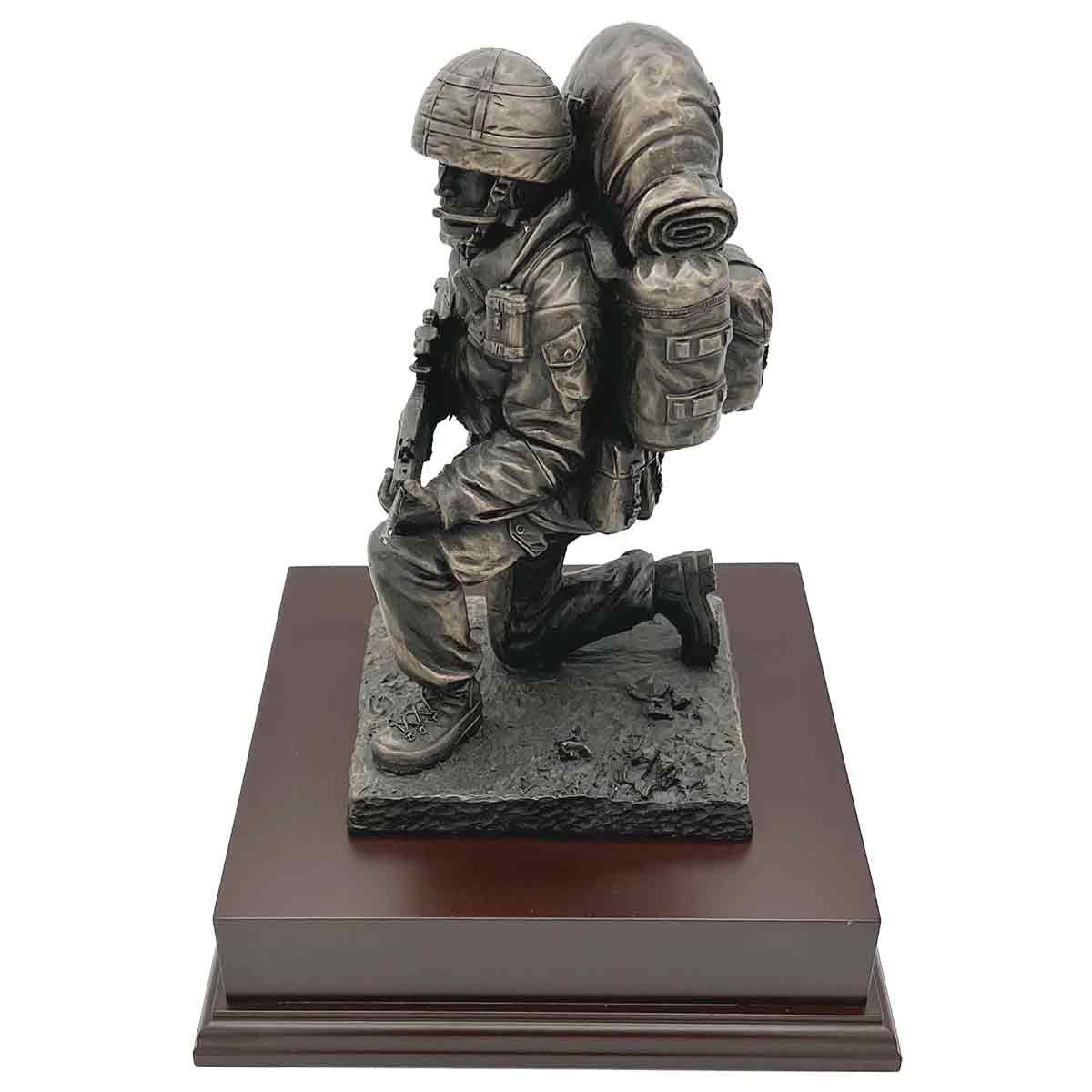 Kneeling Combat Figure with Beret statue in bronze finish, showing soldier in action-ready pose with full combat equipment on wooden base.