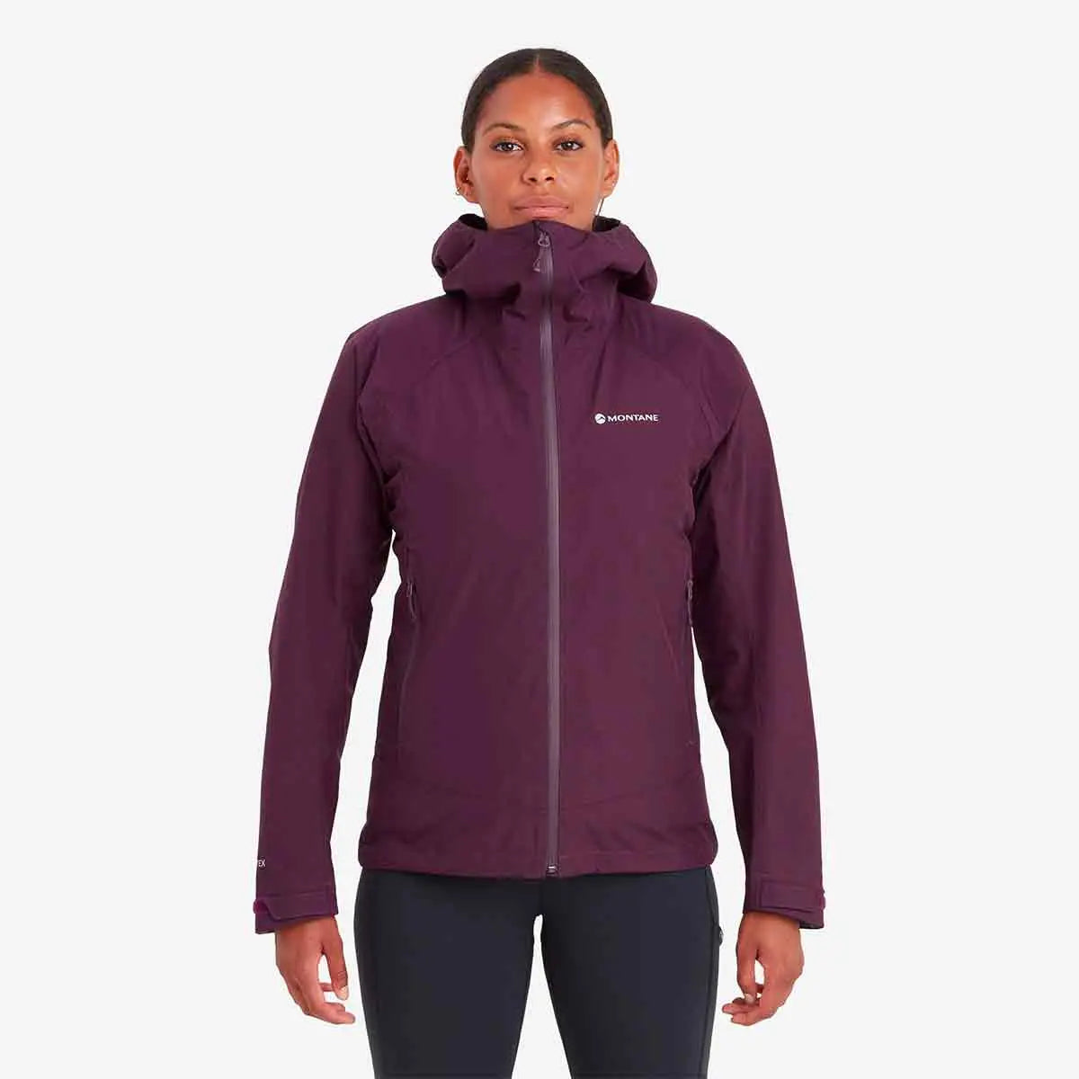 Model wearing Montane Womens Spirit Waterproof Jacket in purple. A lightweight, breathable raincoat for outdoor activities.