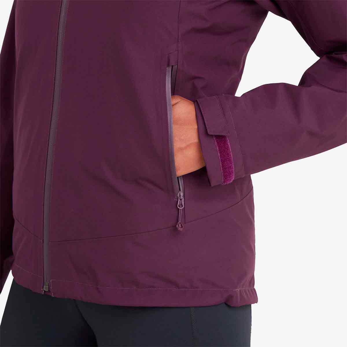 Montane Womens Spirit Waterproof Jacket pocket detail. Zippered pockets offer secure storage for essentials during outdoor activities.