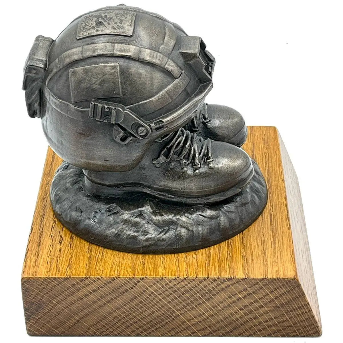 Side view of Helmet and Boots Statue Bronze Resin showing realistic military gear details and solid oak base for sturdy presentation.
