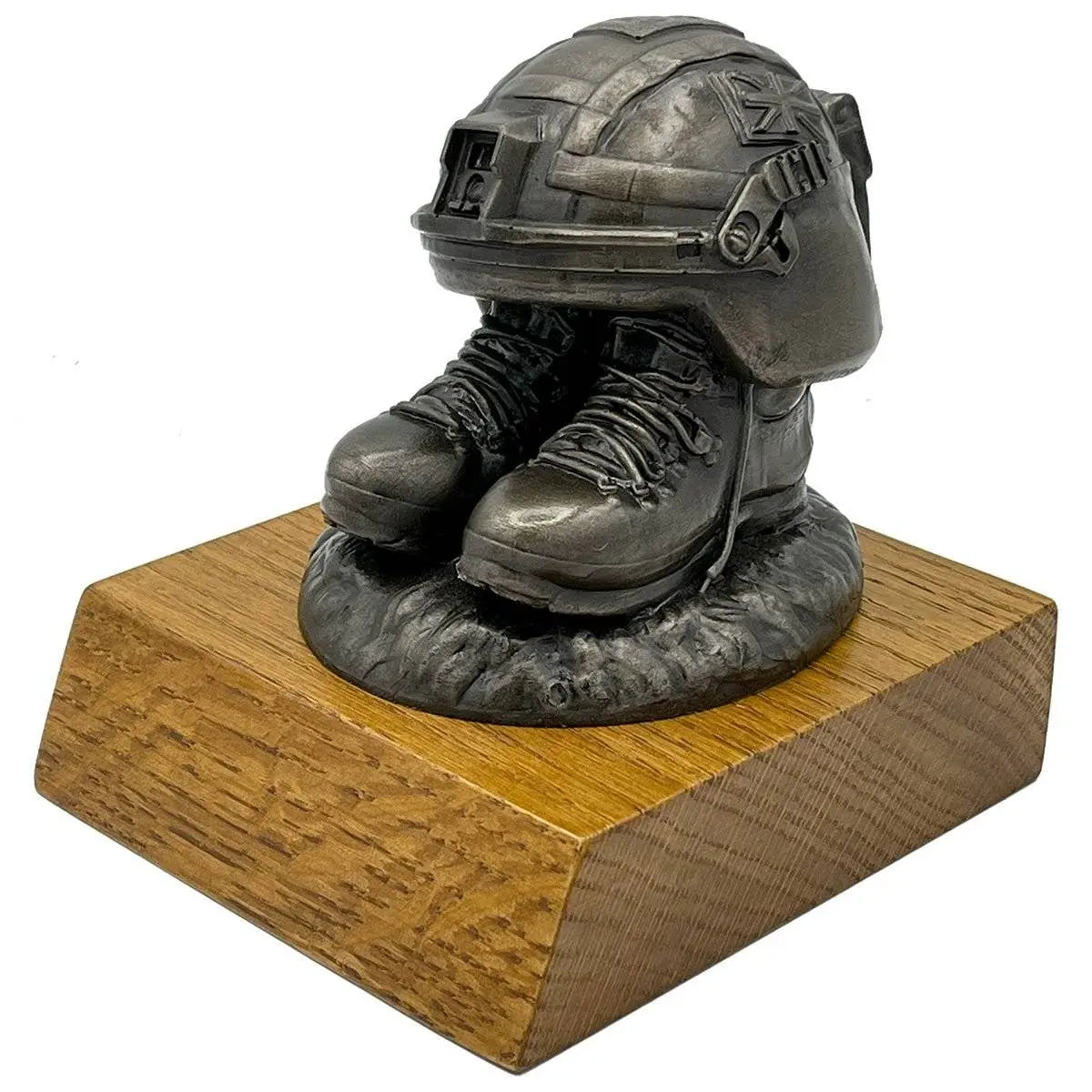 Angled view of Helmet and Boots Statue Bronze Resin highlighting intricate boot laces and helmet straps, perfect for army-themed decor.