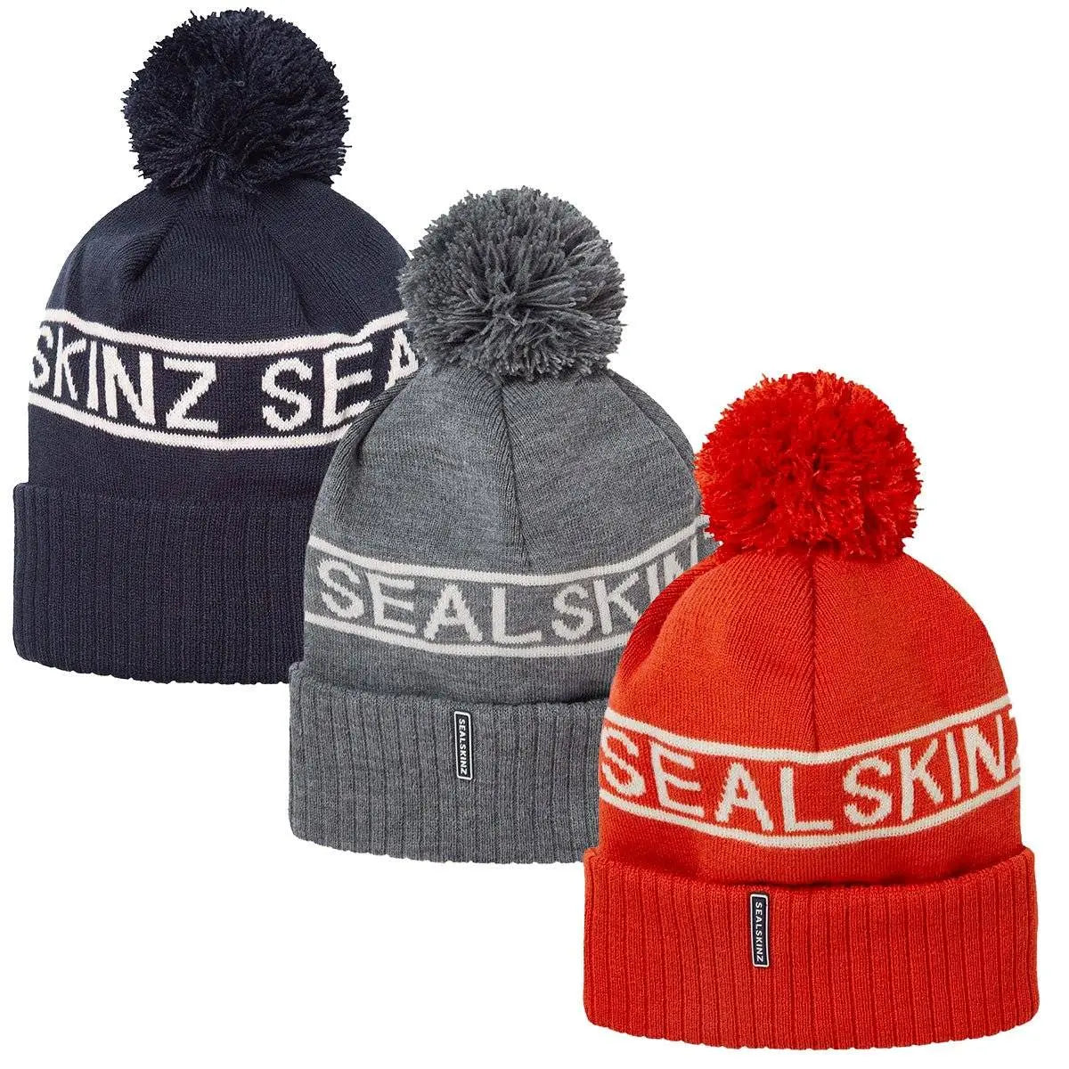 Sealskinz Heacham Waterproof Cold Weather Icon Bobble Hat in navy, grey, and red, ideal winter headwear for adults seeking warmth and style.