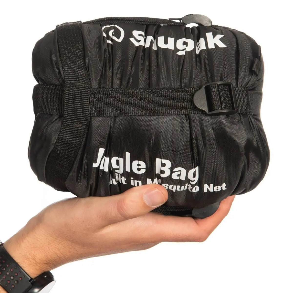 Black Snugpak Jungle Sleeping Bag with Mosquito Net compressed into a small carry size, held in hand for portability reference.