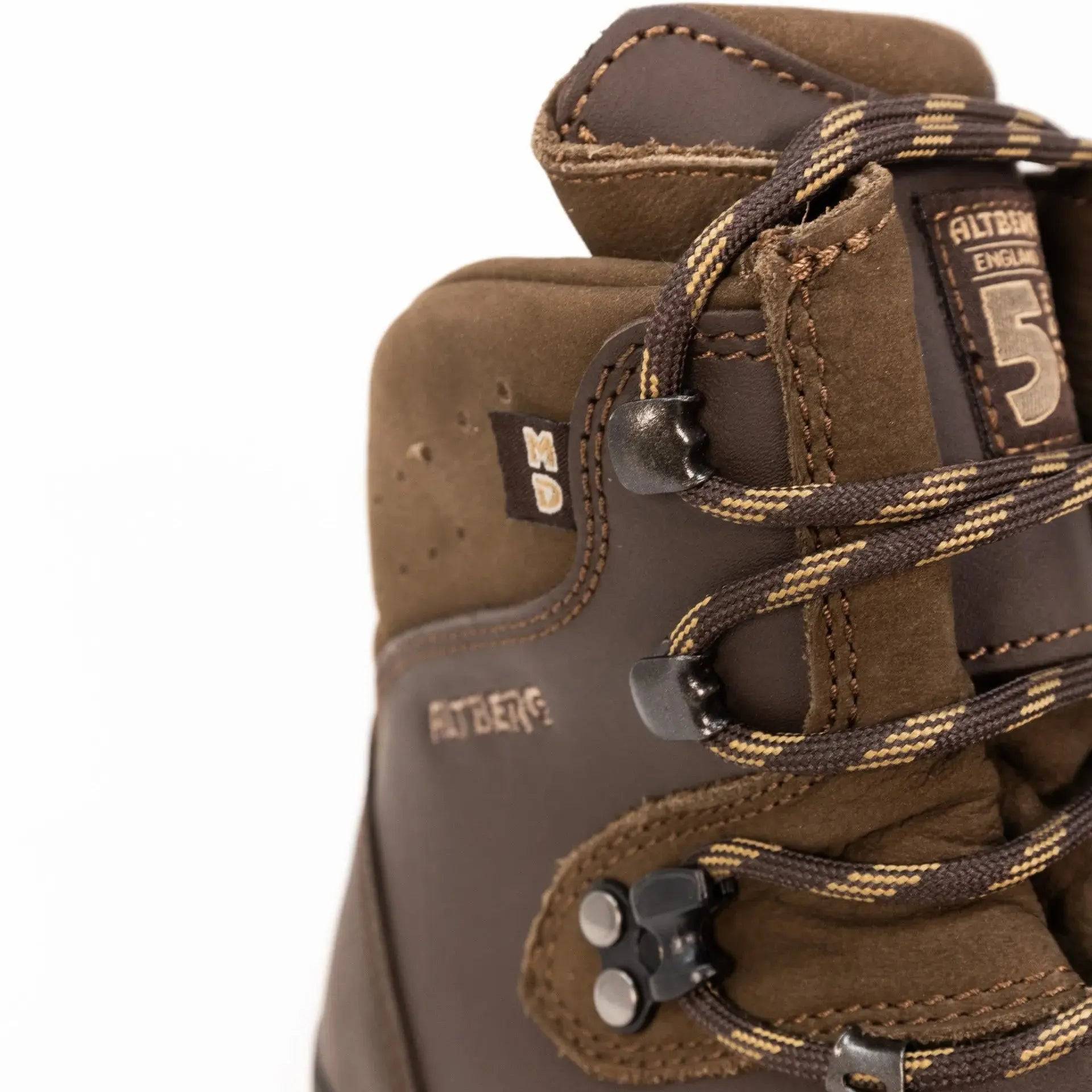 Detailed close-up of Altberg Tethera Men's Leather Walking Boot, showcasing premium leather, reinforced stitching, and durable metal lace hooks.