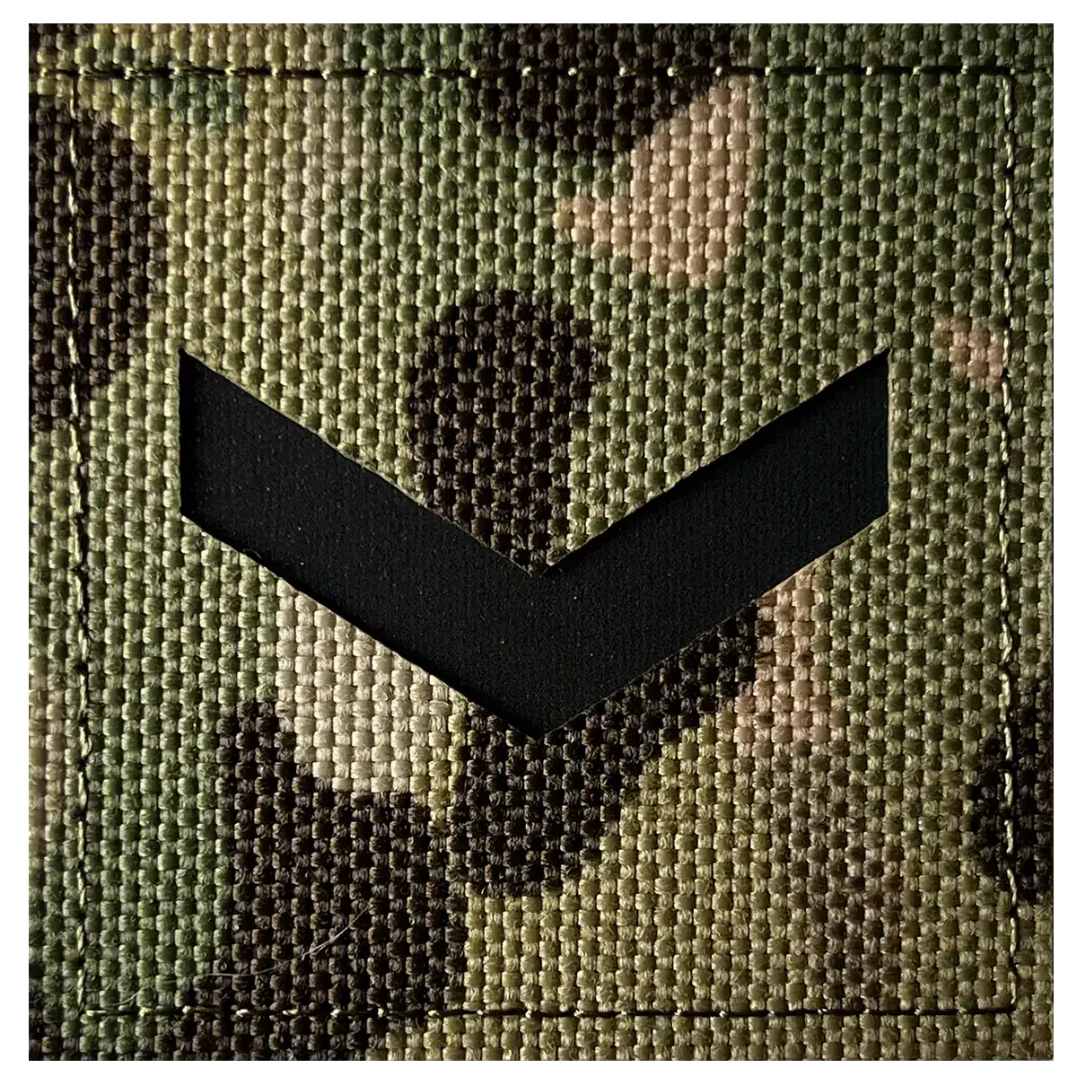 Close-up of camouflage fabric with black laser cut rank insignia on Army Rank Square Laser Cut Hook & Loop TRF Multicam patches, 5x5cm.