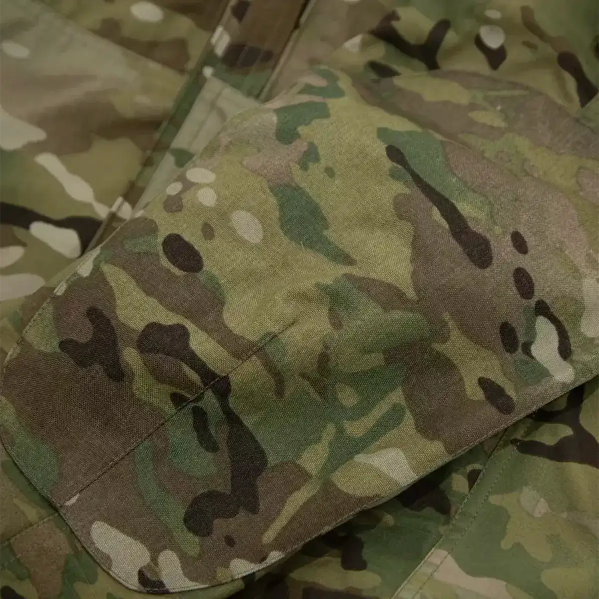 Multicam camouflage tactical jacket with multiple pockets and zippers  from  John Bull Clothing 