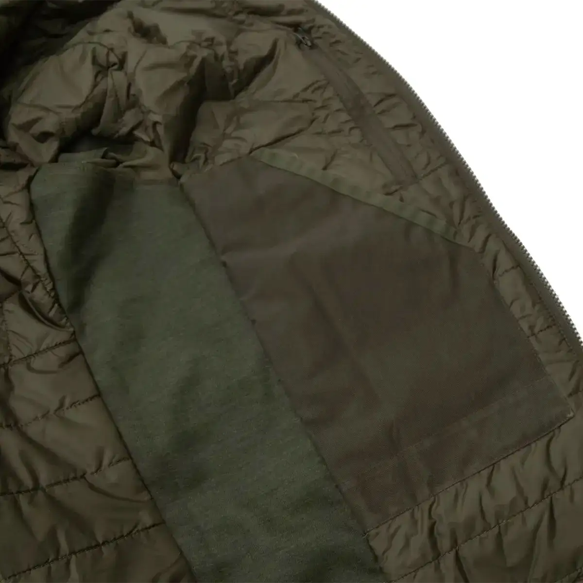 Close-up of the Carinthia logo tag inside the jacket, size L, in olive green color, designed for military and tactical wear