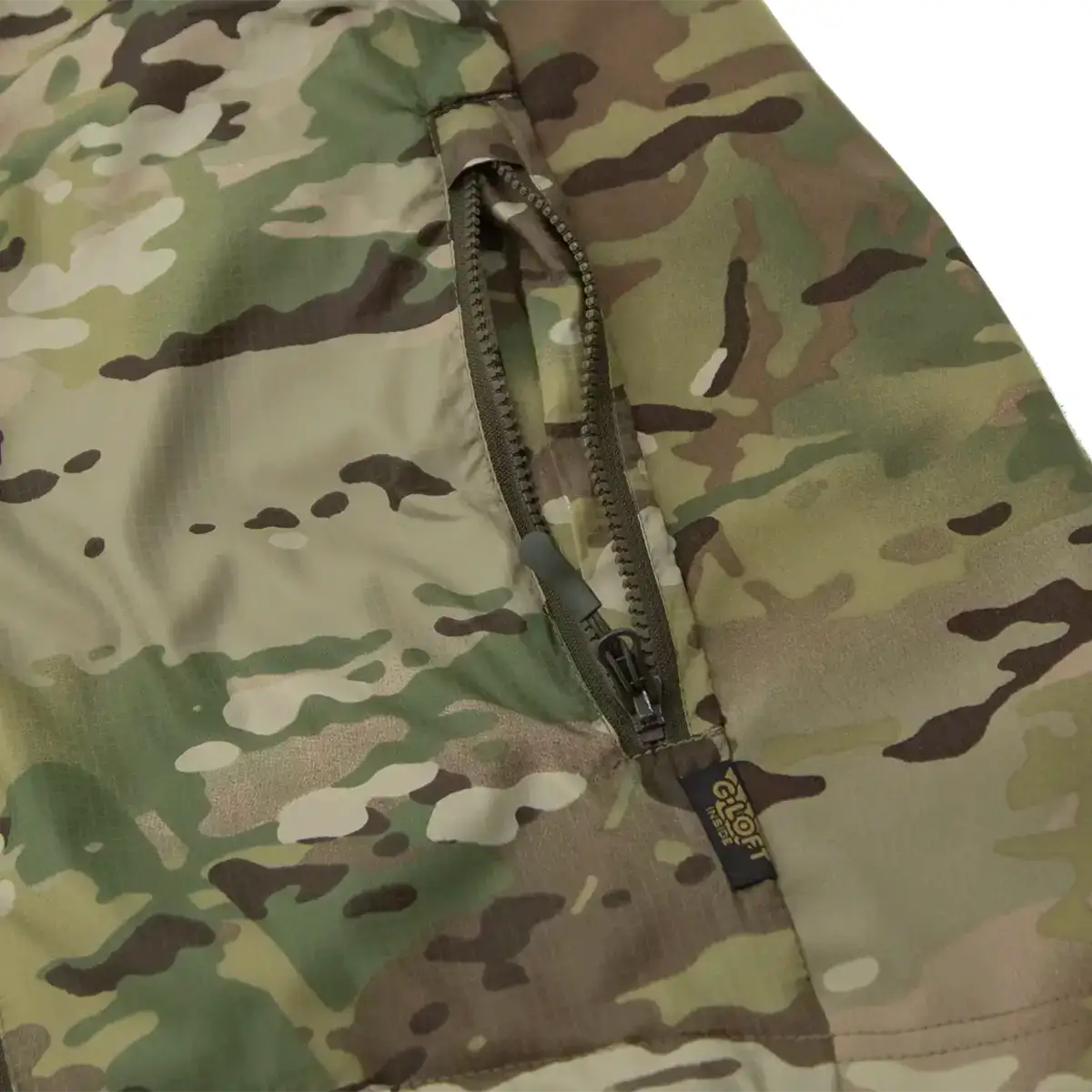 Carinthia TLG 2.0 G-Loft Jacket in Multicam camouflage with front zipper pocket, lightweight tactical design, suitable for outdoor military use