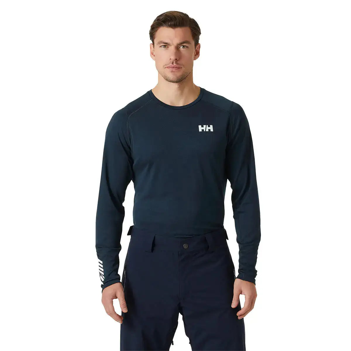 Front view of male model in navy HH Lifa Active Crew Long Sleeve Base Layer, ideal for activewear layering at John Bulls.  from  John Bull Clothing 