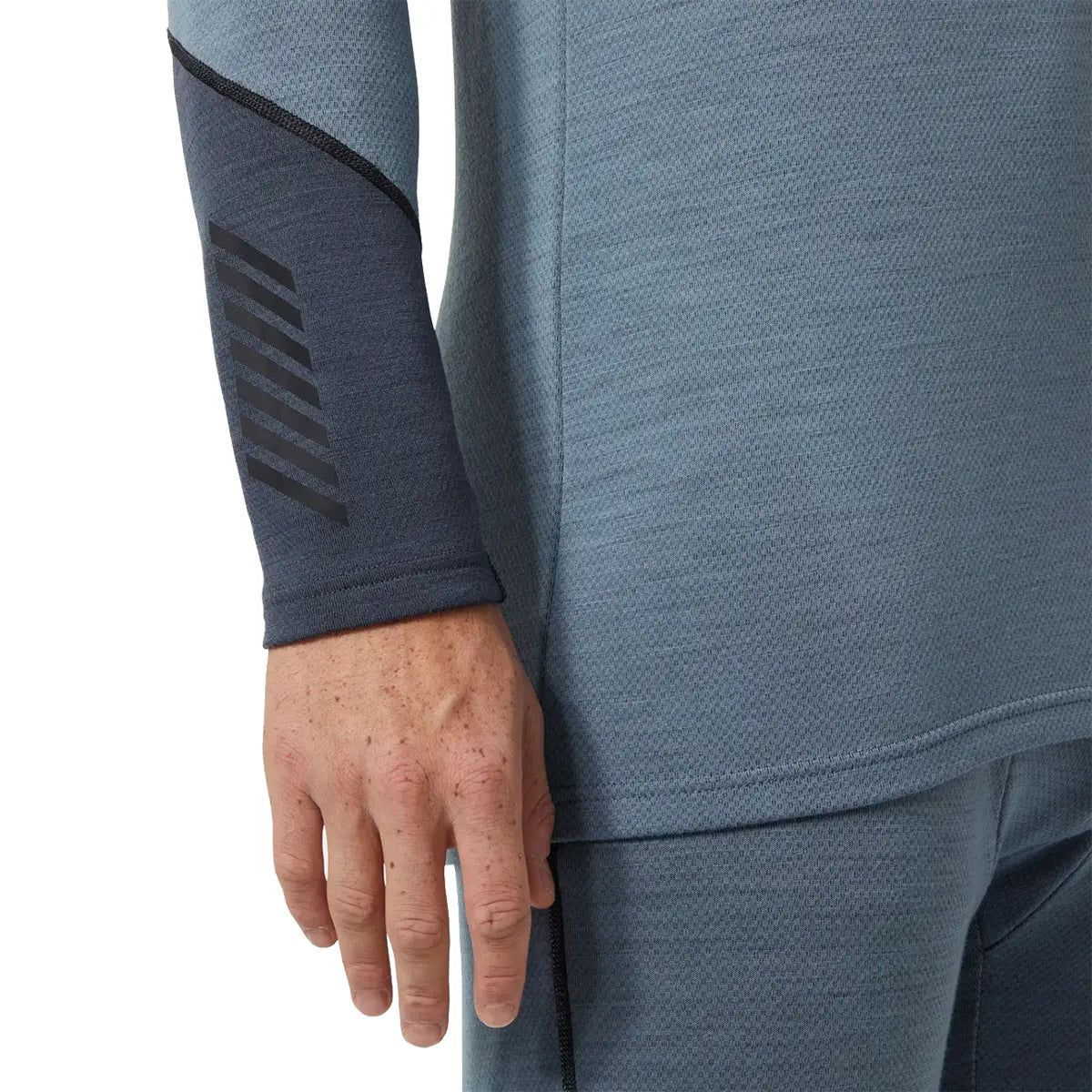 Close-up of sleeve detail on Helly Hansen Lifa Midweight Logo Merino Base Layer featuring contrast cuff and textured fabric for comfort and grip.