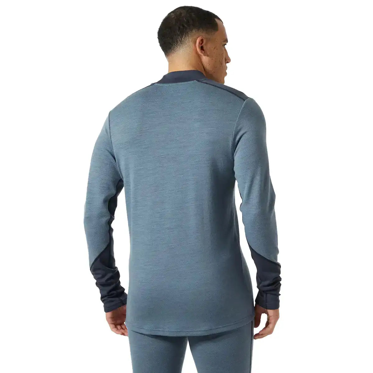 Back view of Helly Hansen Lifa Midweight Logo Merino Base Layer highlighting ergonomic seam placement and extended length for coverage.  from  John Bull Clothing 